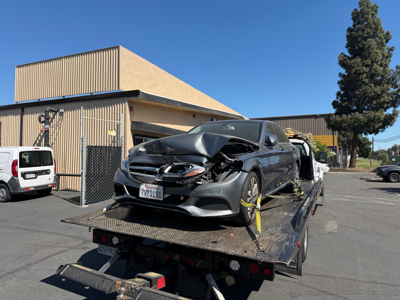 Damaged Mercedes sedan loaded onto 24-7 Rescue Towing flatbed for accident recovery service in Antioch California