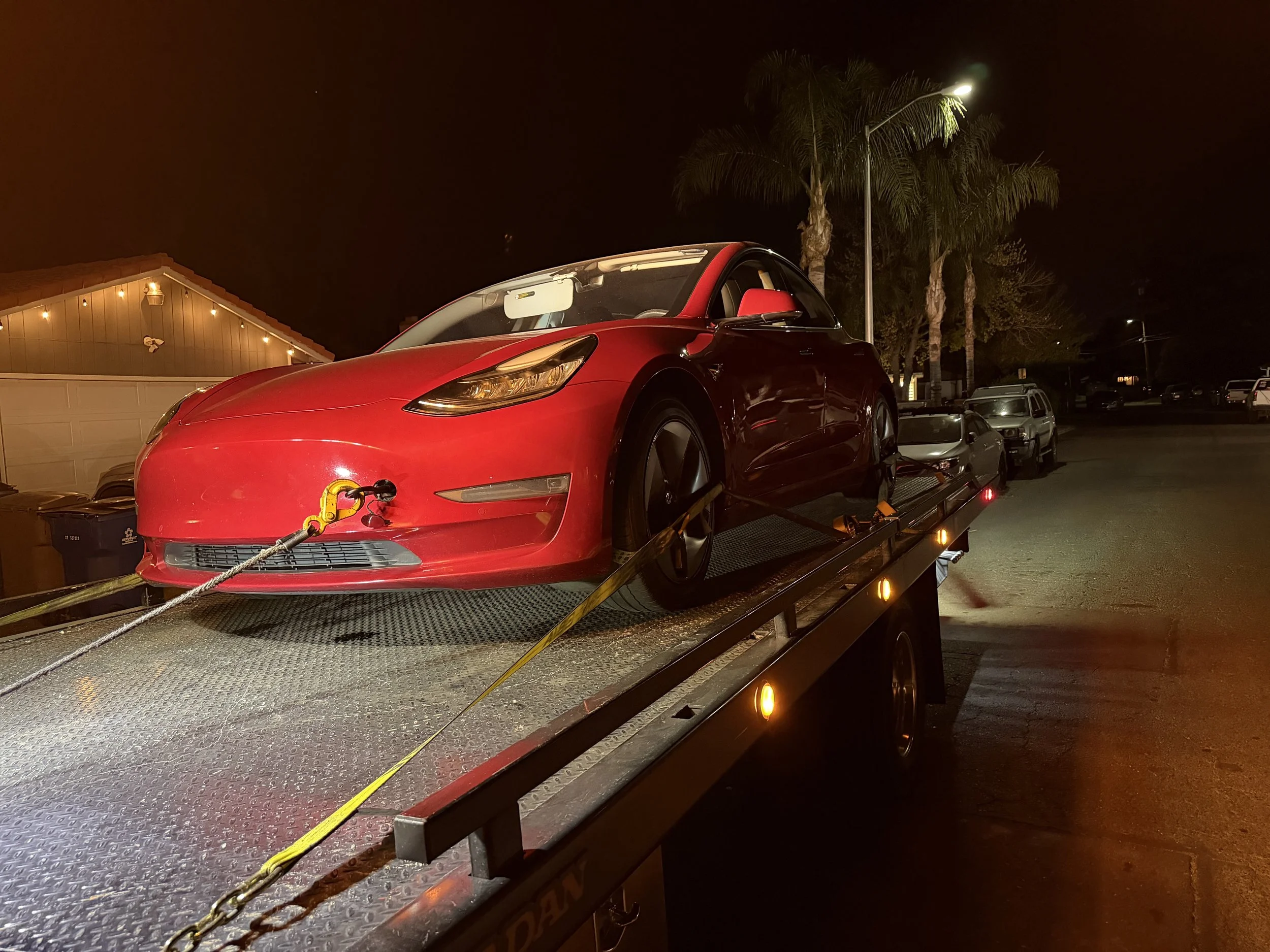 Tesla Model 3 being transported by 24-7 Rescue Towing flatbed service in Bay Point CA