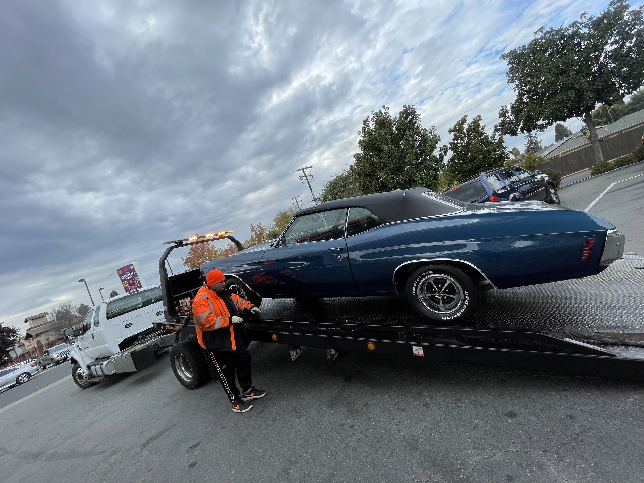 Classic car safely loaded onto a flatbed tow truck in Antioch CA by 24-7 Rescue Towing providing professional vehicle transport and towing services.