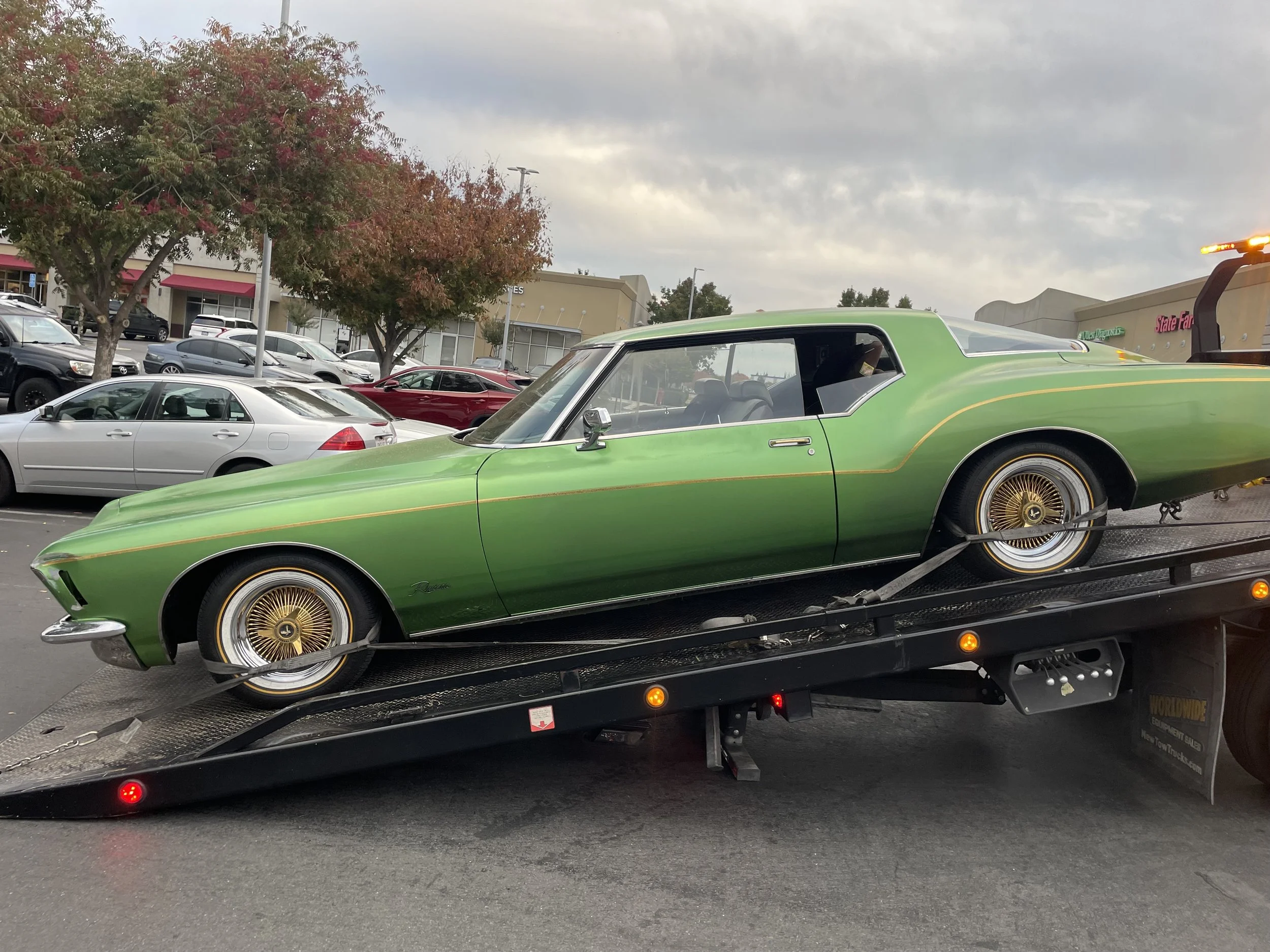 Classic car towing on flatbed truck in Antioch CA