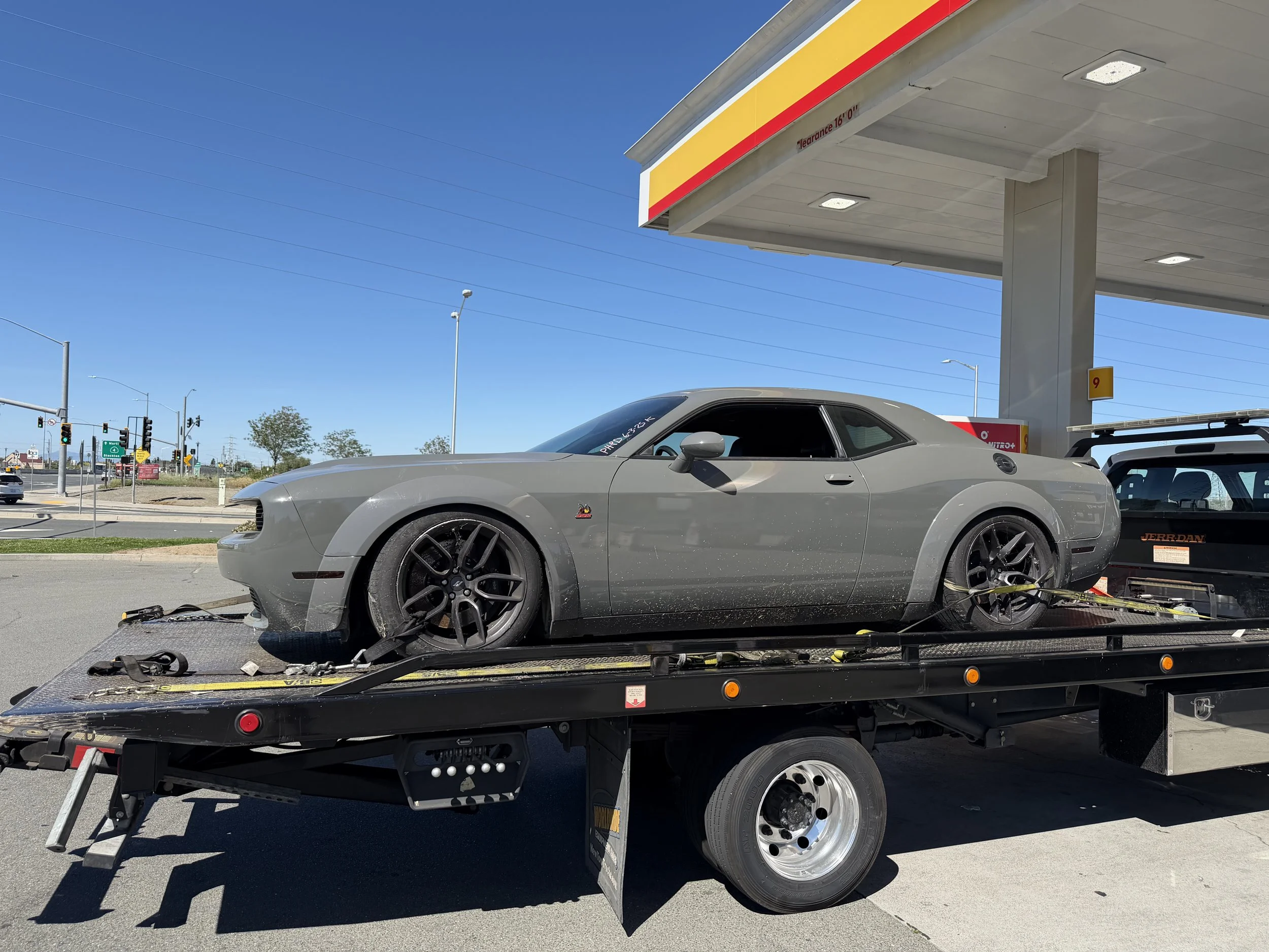Emergency towing service in Antioch CA transporting Dodge Challenger on flatbed tow truck by 24-7 Rescue Towing
