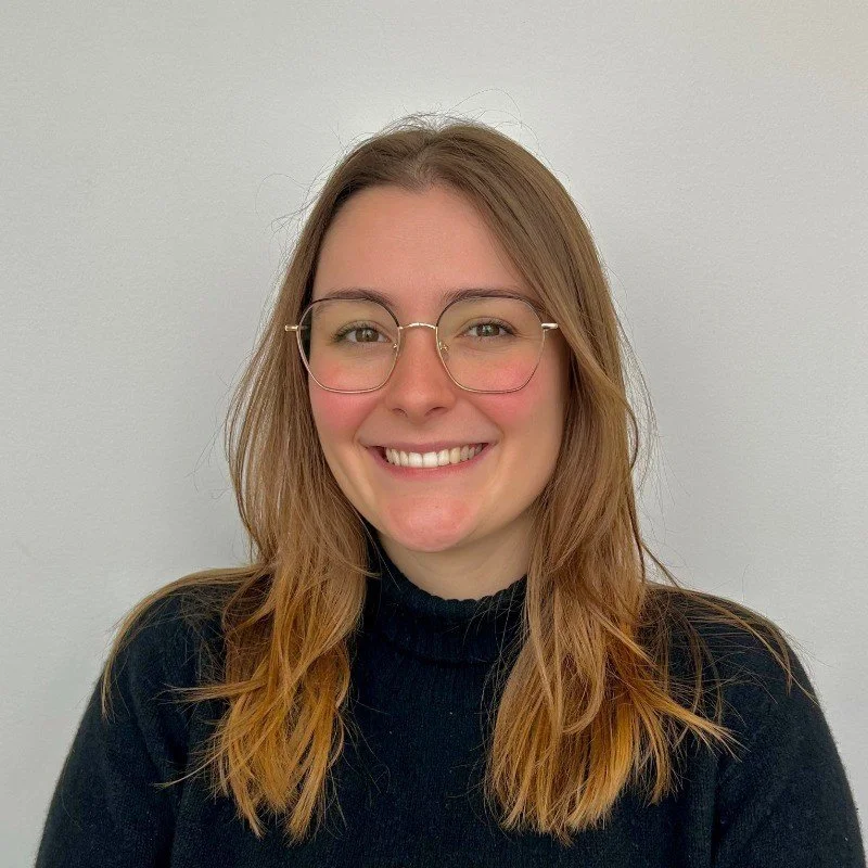 Image of Mathilde wearing glasses and a black shirt.