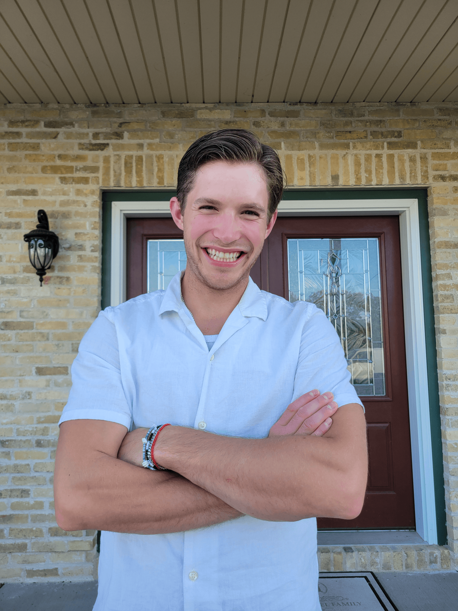 Picture of Daniel Seeley, a team member of Wisconsin Upholstery, smiling with arms crossed.