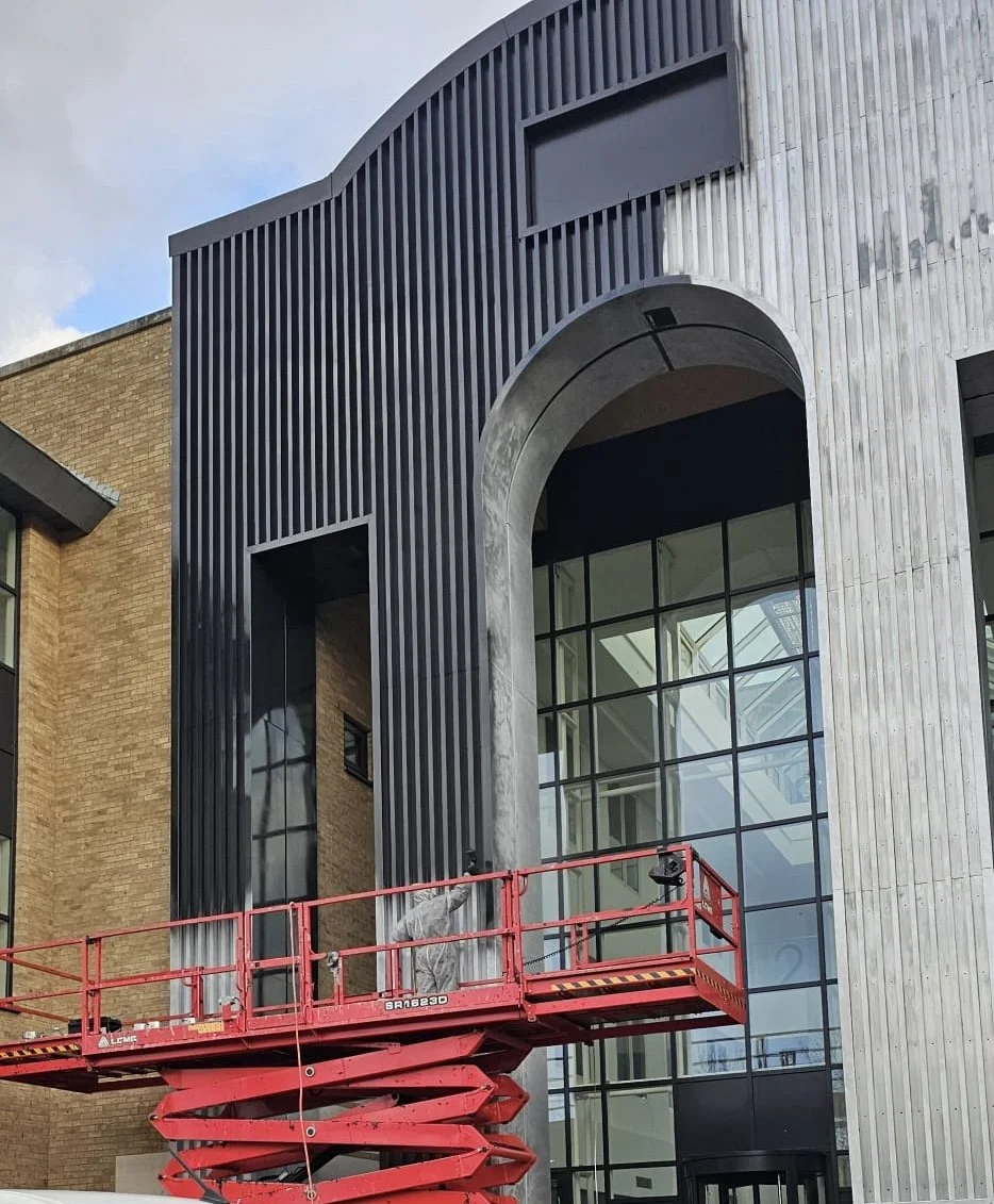 Our team painting cladding on a ipaf