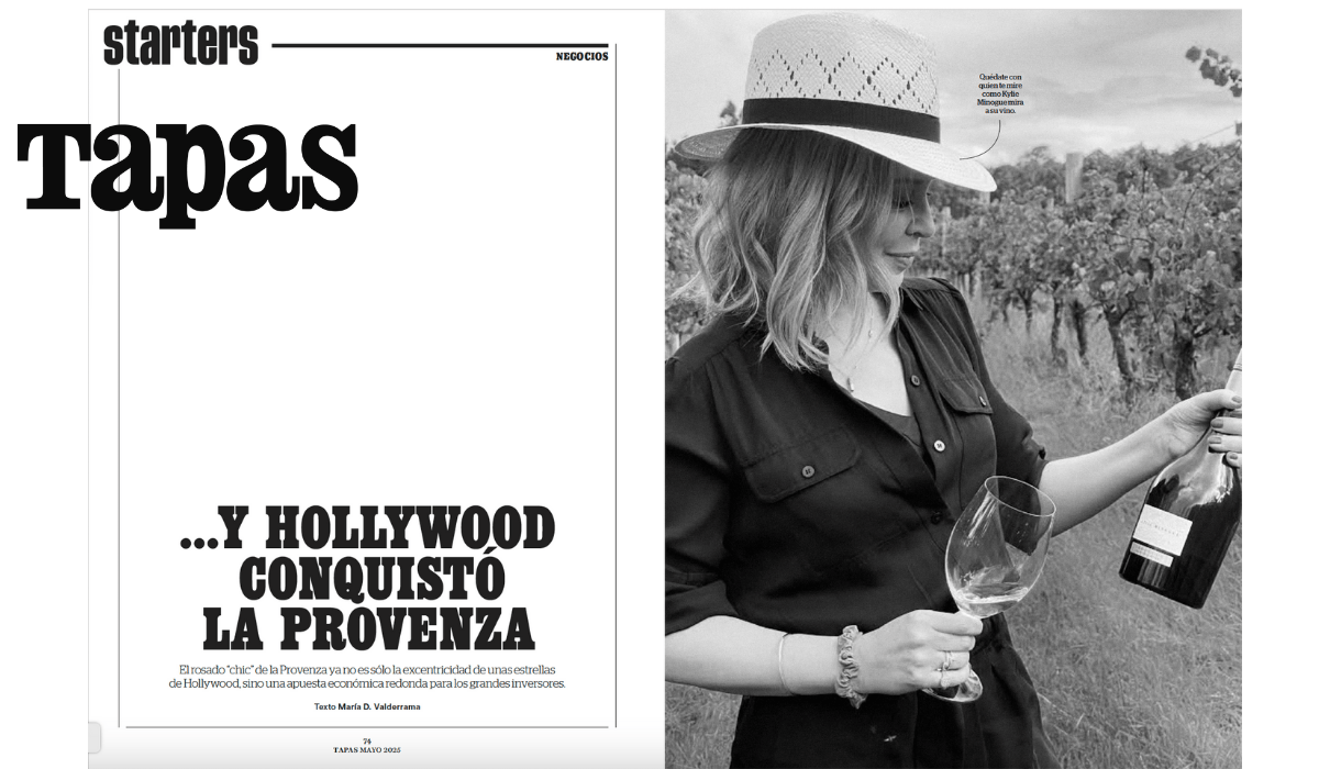 Página de una revista de negocios mostrando una sección de tapas titulada 'y Hollywood conquistó la Provenza', y una mujer con sombrero, sosteniendo una copa de vino y una botella, en un viñedo.