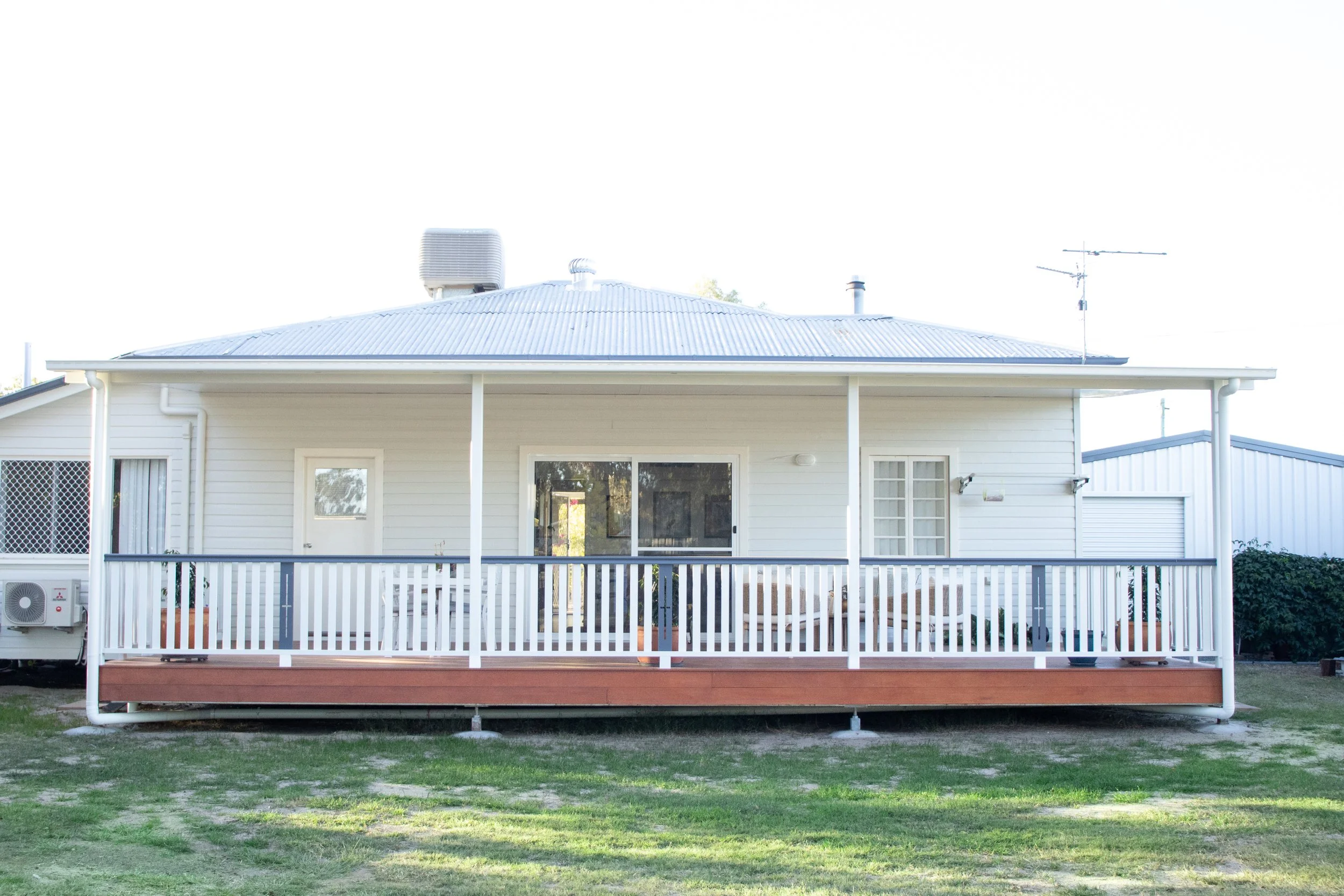 A rear deck with merbau timber and solarspan roof.