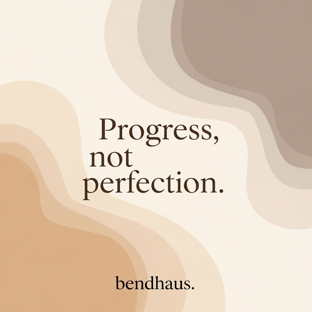 Motivational quote on a beige and brown abstract background that reads 'Progress, not perfection.' bendhaus.