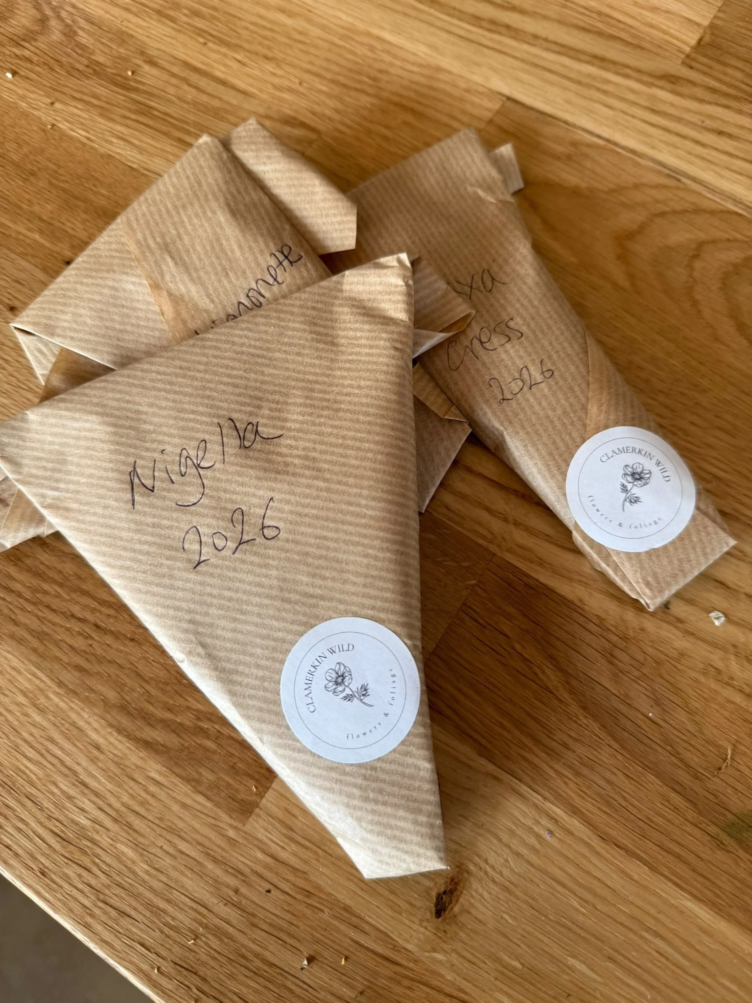 Packets of home-saved flower seed, cleaned and labelled ready for spring sowing at Clamerkin Wild