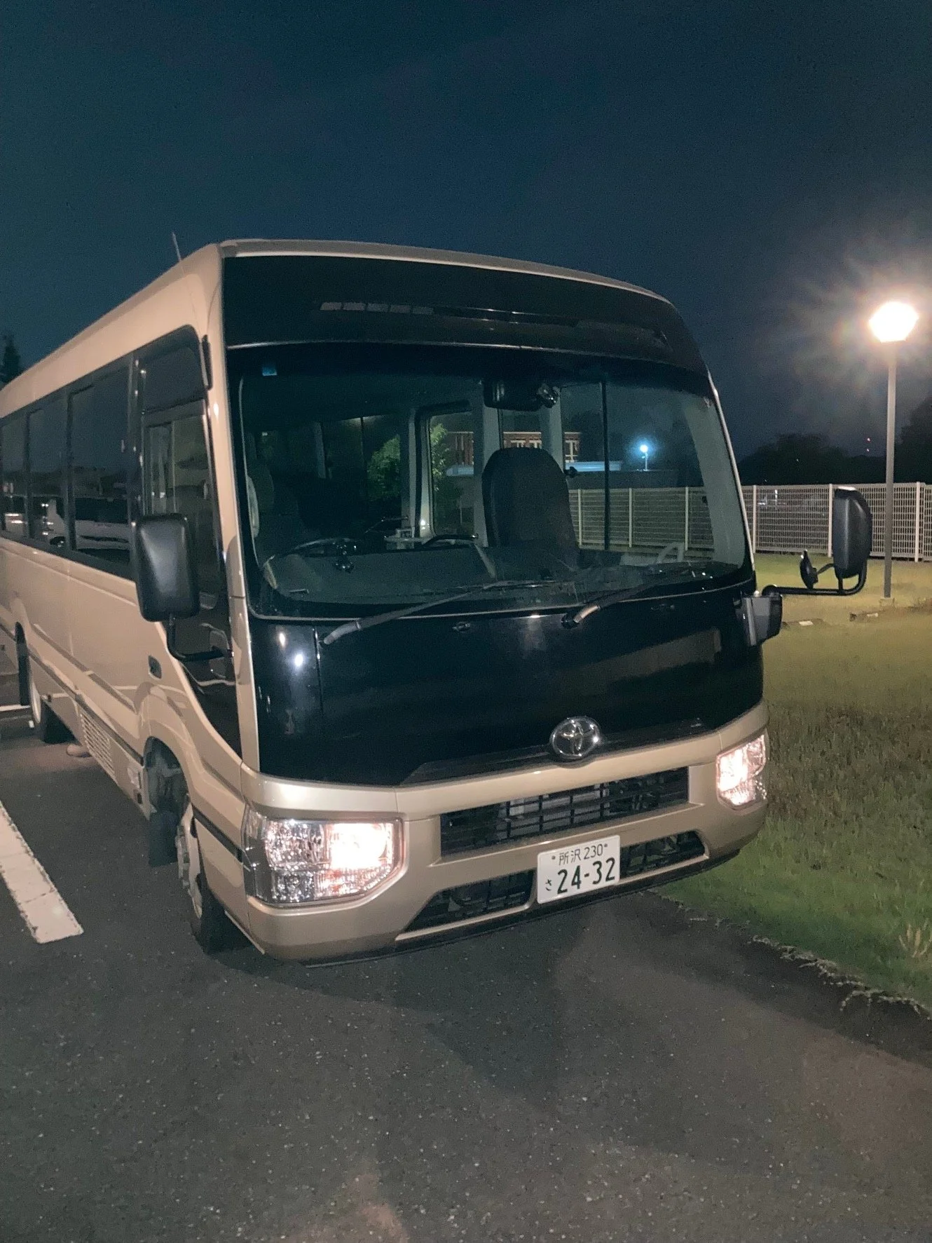 Charter minibus at night ready for group tours in Tokyo