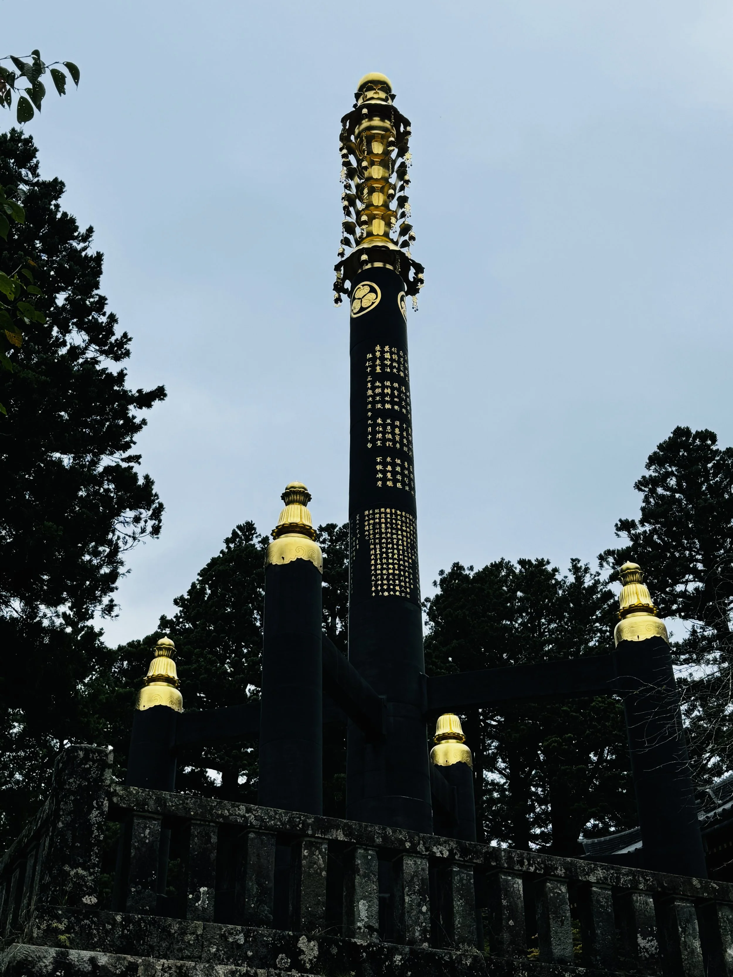 Golden Buddhist Sorinto display at a Nikko shrine museum (pagoda finial)