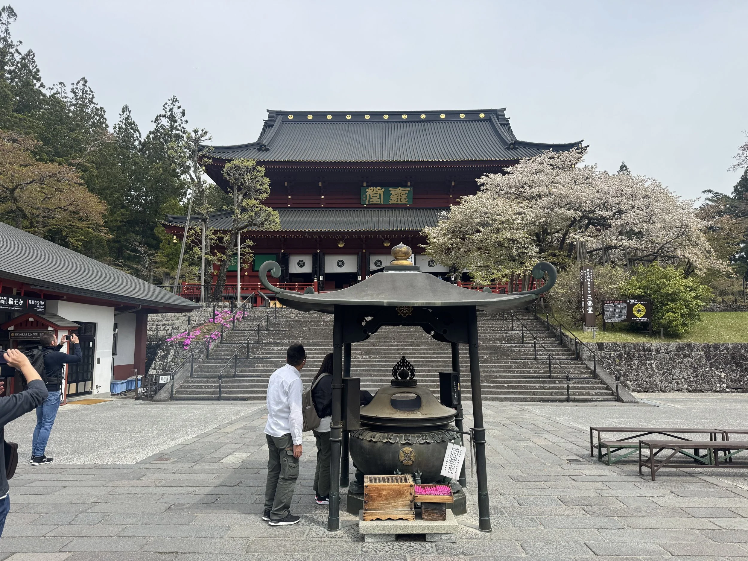 Rinnoji temple in Nikko with stone lanterns and gate at the entrance