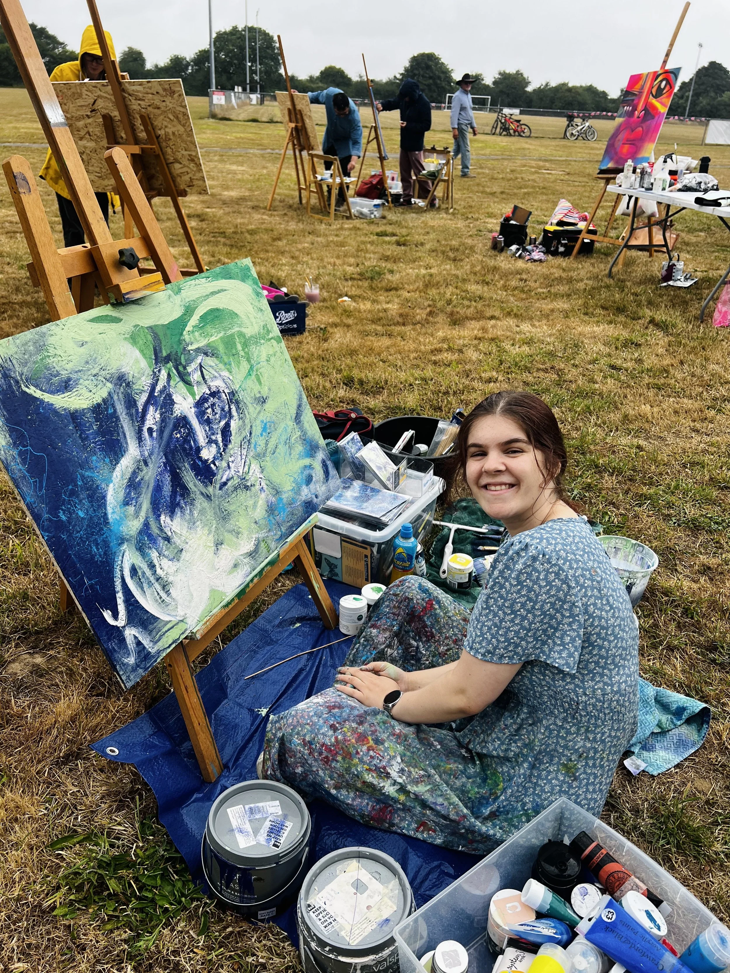 Artist sat outside painting