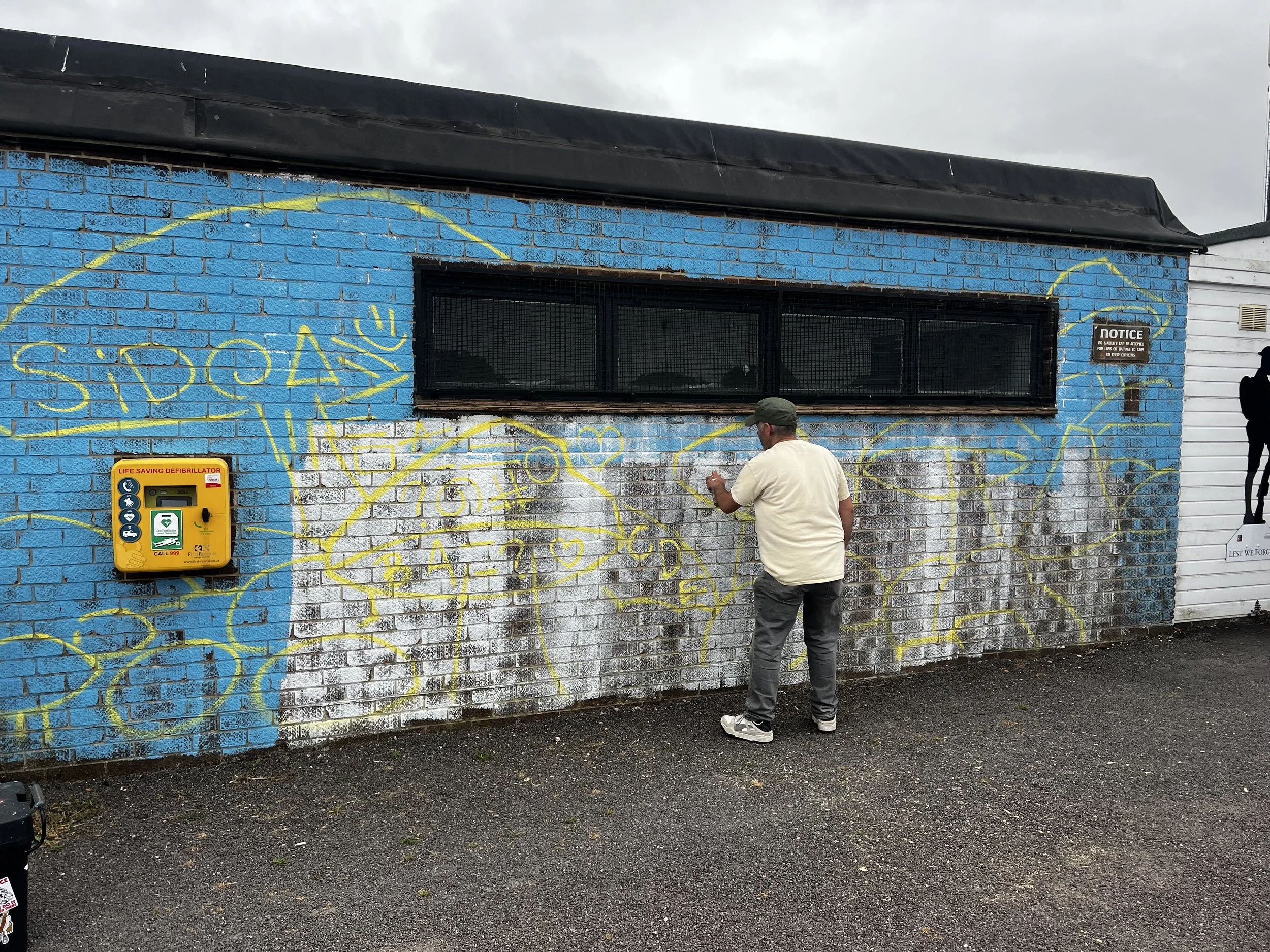 Mural artist starting a big piece of work