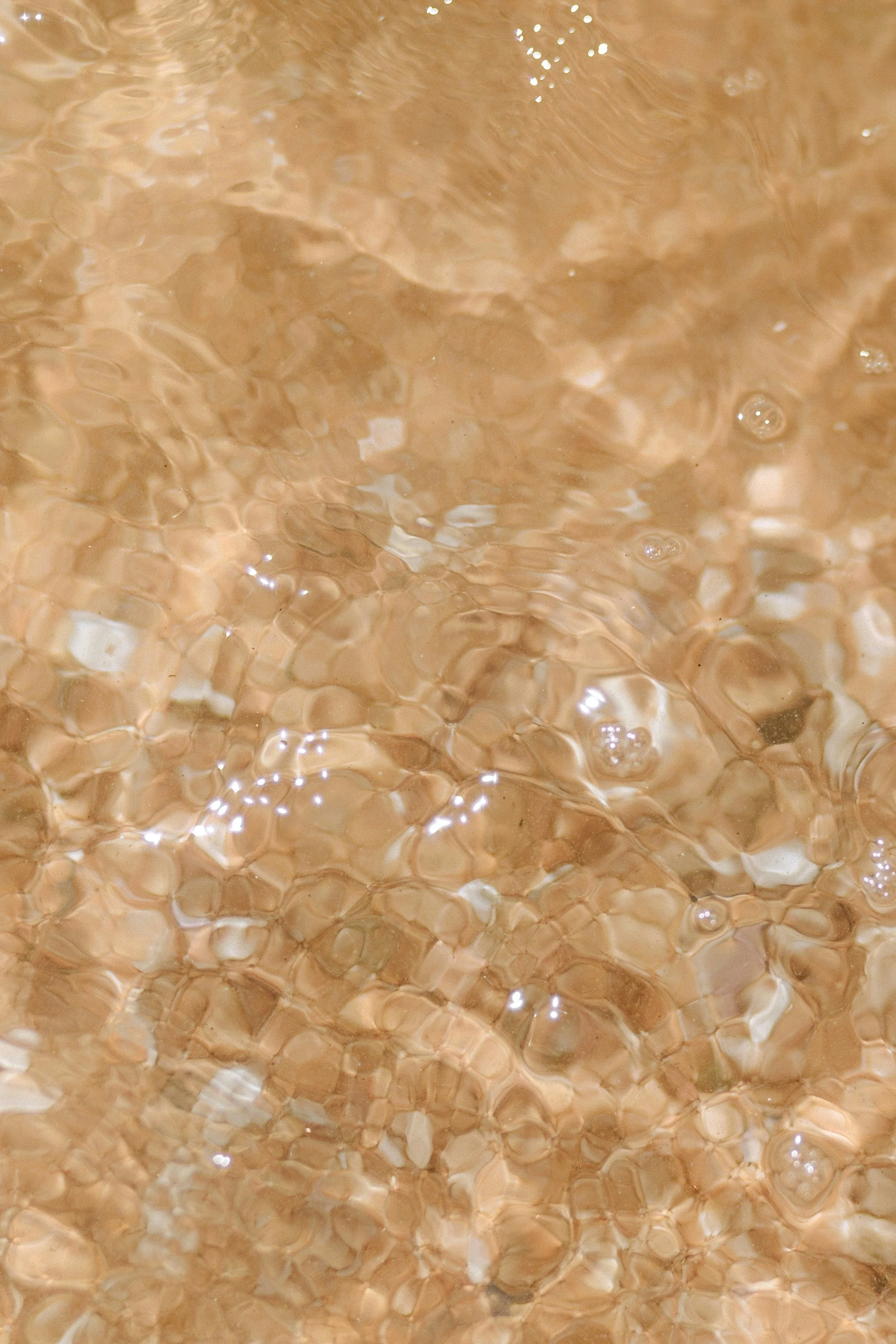 golden water surface close-up illustrating spiritual workshops and healing sessions in bangkok thailand
