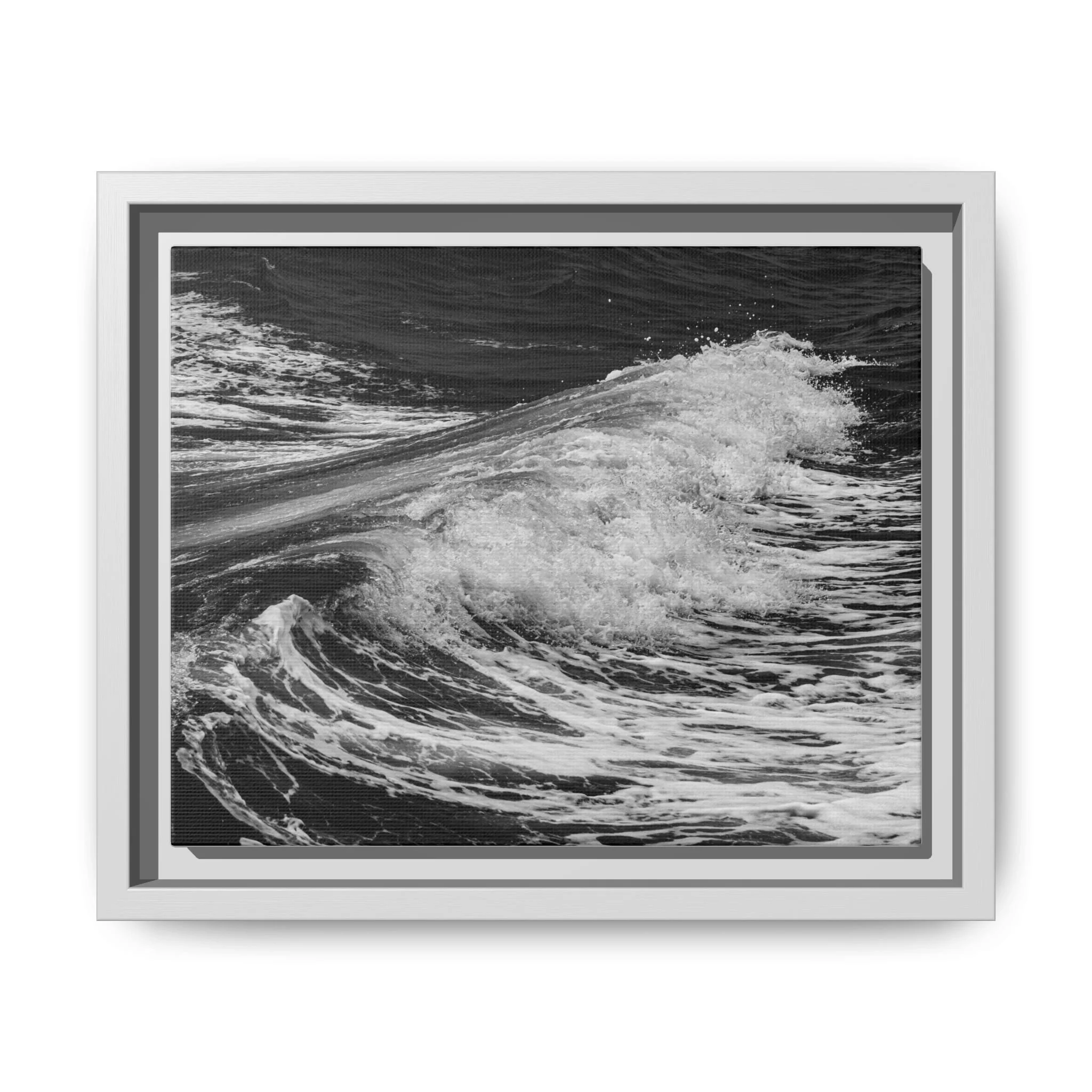 Framed monochrome canvas print of a breaking ocean wave photographed in Maui, Hawaii