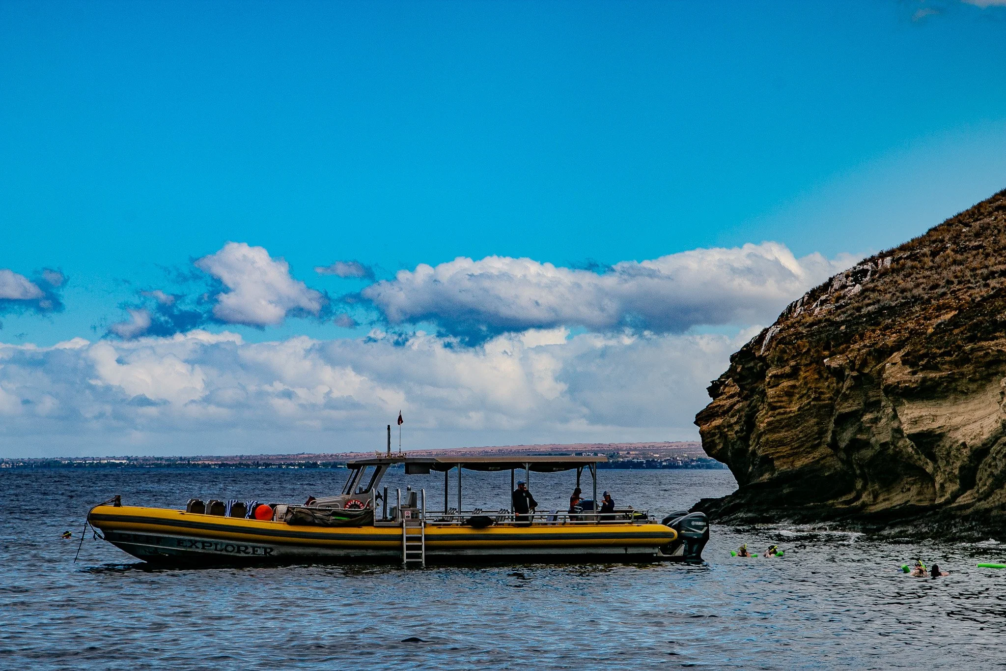 Snorkeling raft tied up near the sheltered waters of Molokini Crater, a crescent-shaped volcanic formation just off Maui’s southern coastline.
