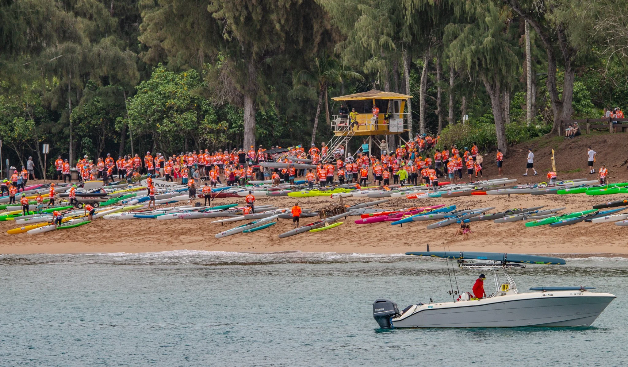 Outrigger canoe and surf ski racers gathered on D.T. Fleming Beach Park in Kapalua Maui before an ocean race