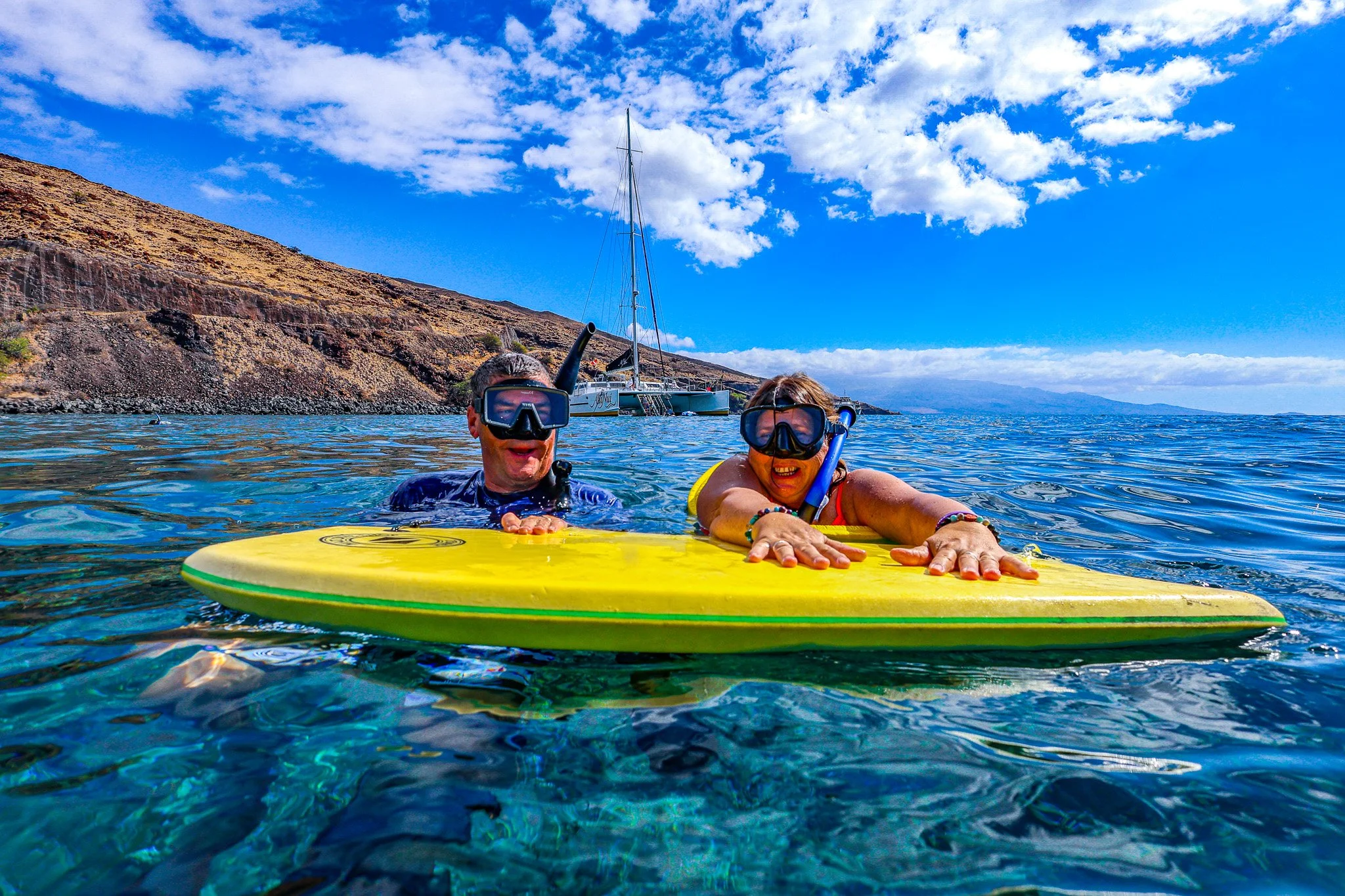 This is your humble host and photographer Theron of Peckphotographyart with my wife of over 30 years having a blast snorkeling at Molokini Crater. Come join us! Lots of fun.