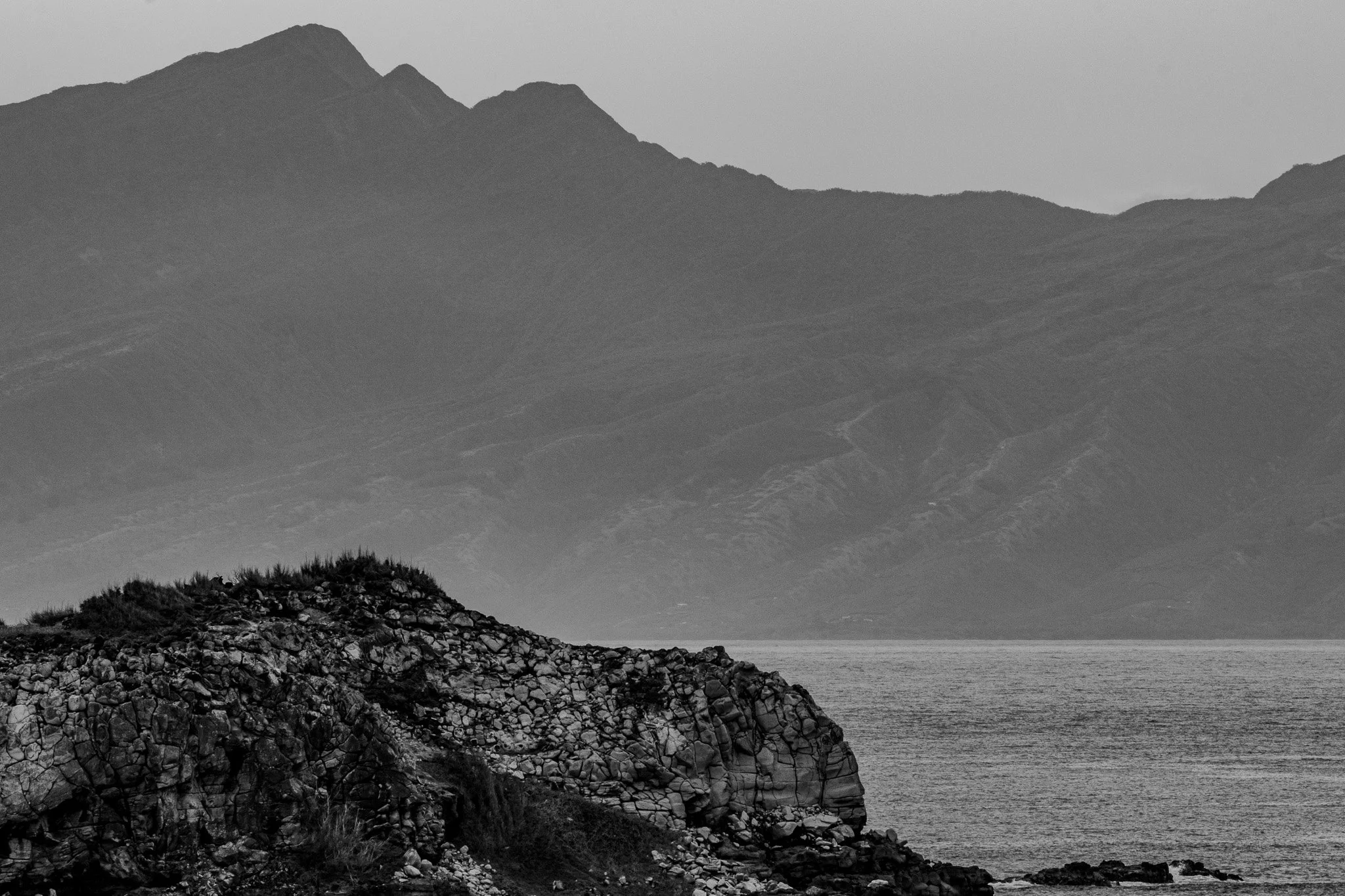 View of Molokaʻi across the Pailolo Channel from the Dragon’s Teeth lava formations in Kapalua on Maui
