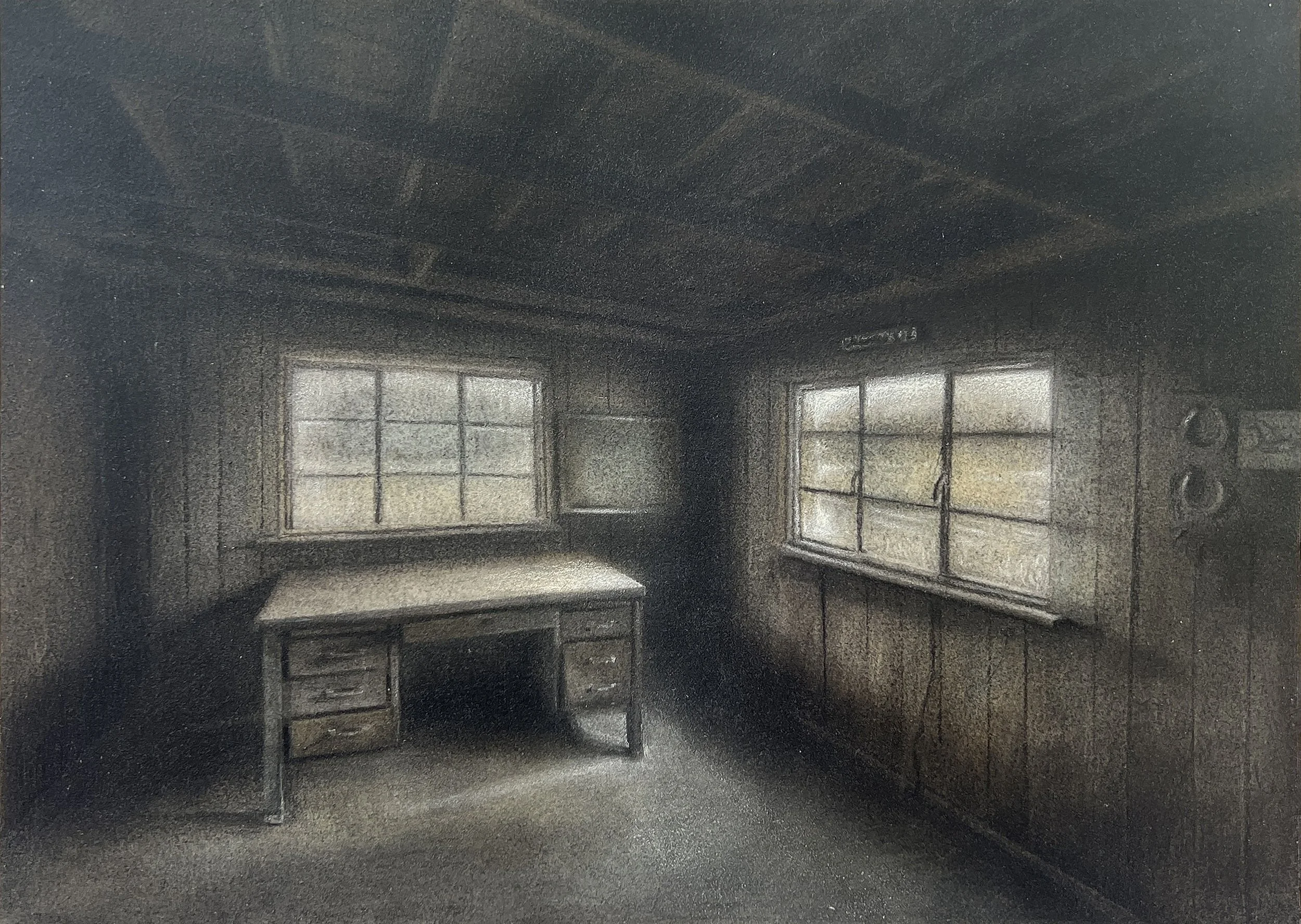 An abandoned office and desk in a rural barn