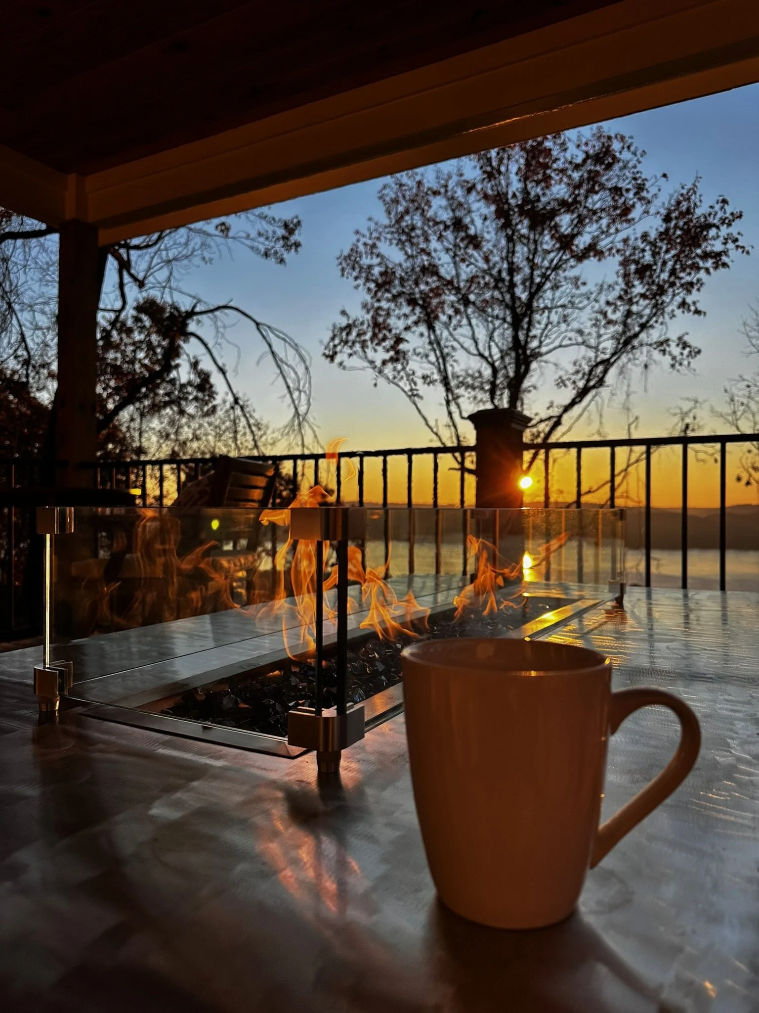 Cabin view of sunset and fireplace