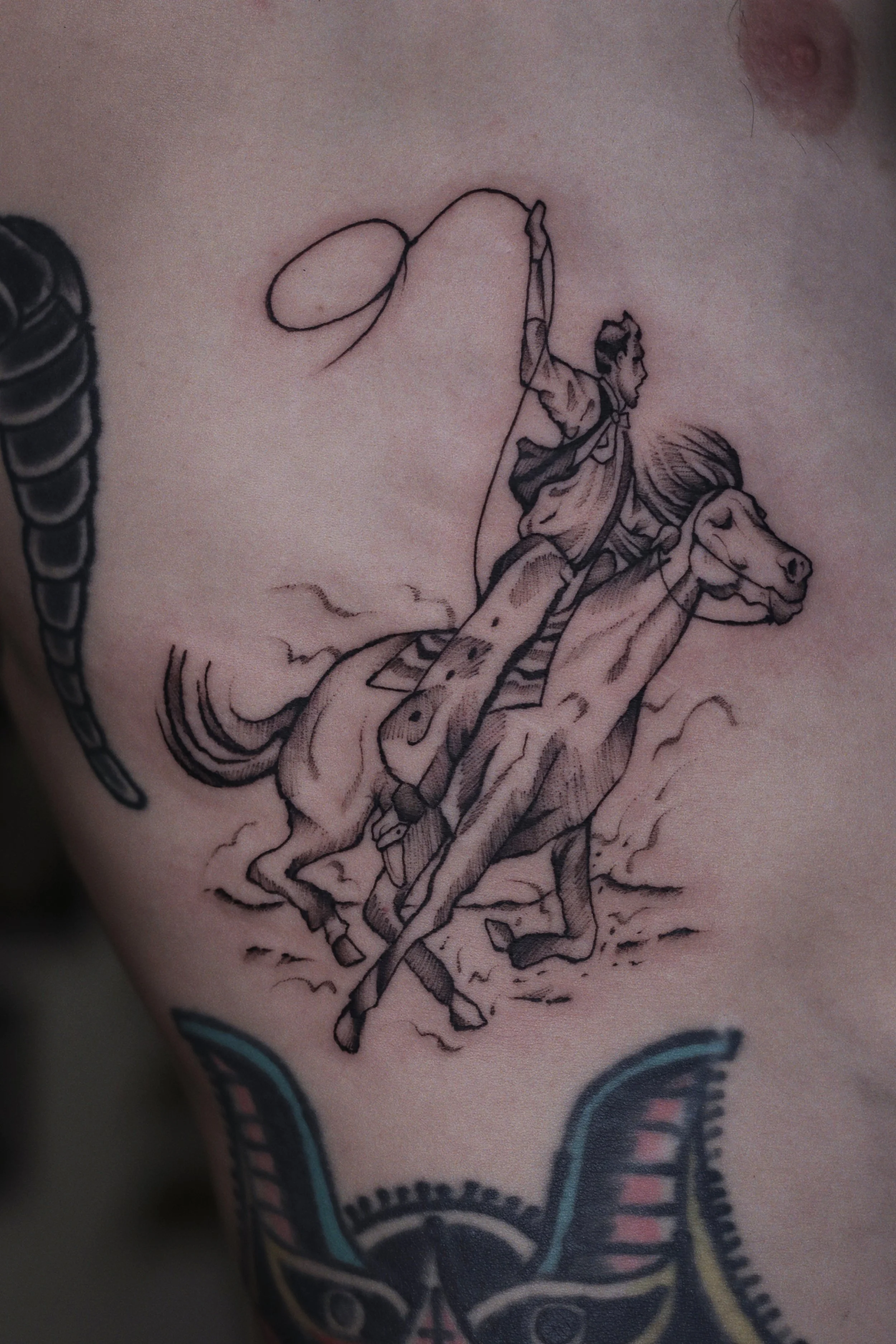 Tattoo of a sketch of a cowboy riding a horse 