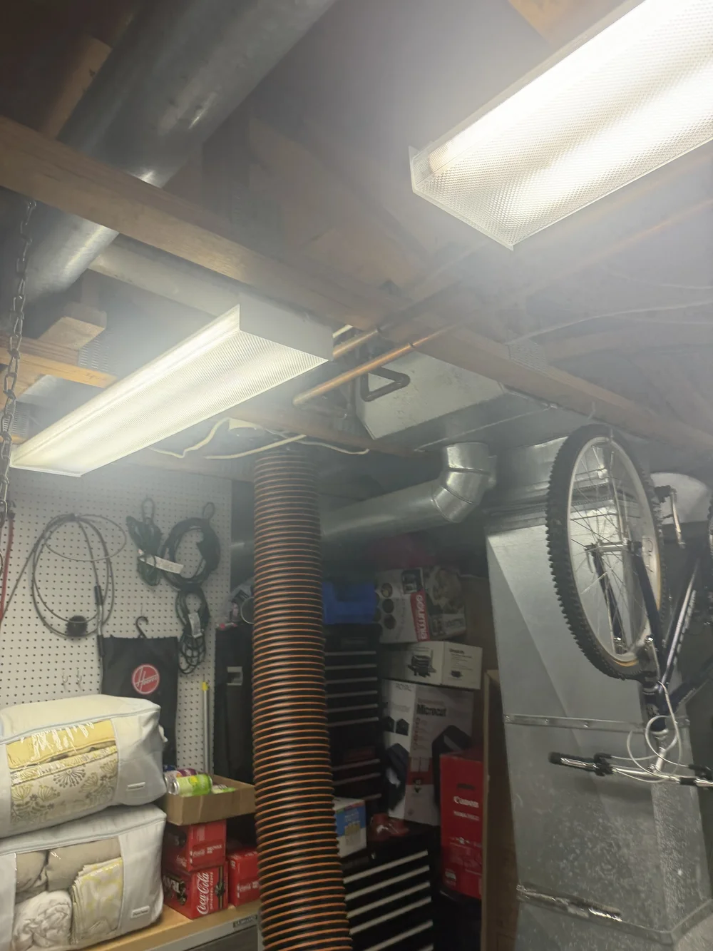 Negative air hose connected to residential ductwork by Air Duct Pros, Inc.