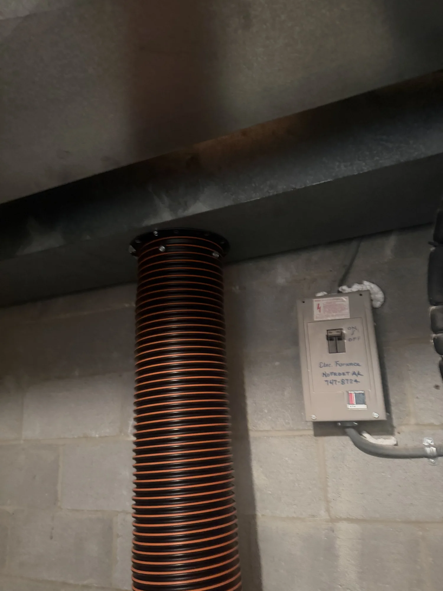 Large negative pressure vacuum hose connected directly to ductwork during air duct cleaning in Catonsville Maryland