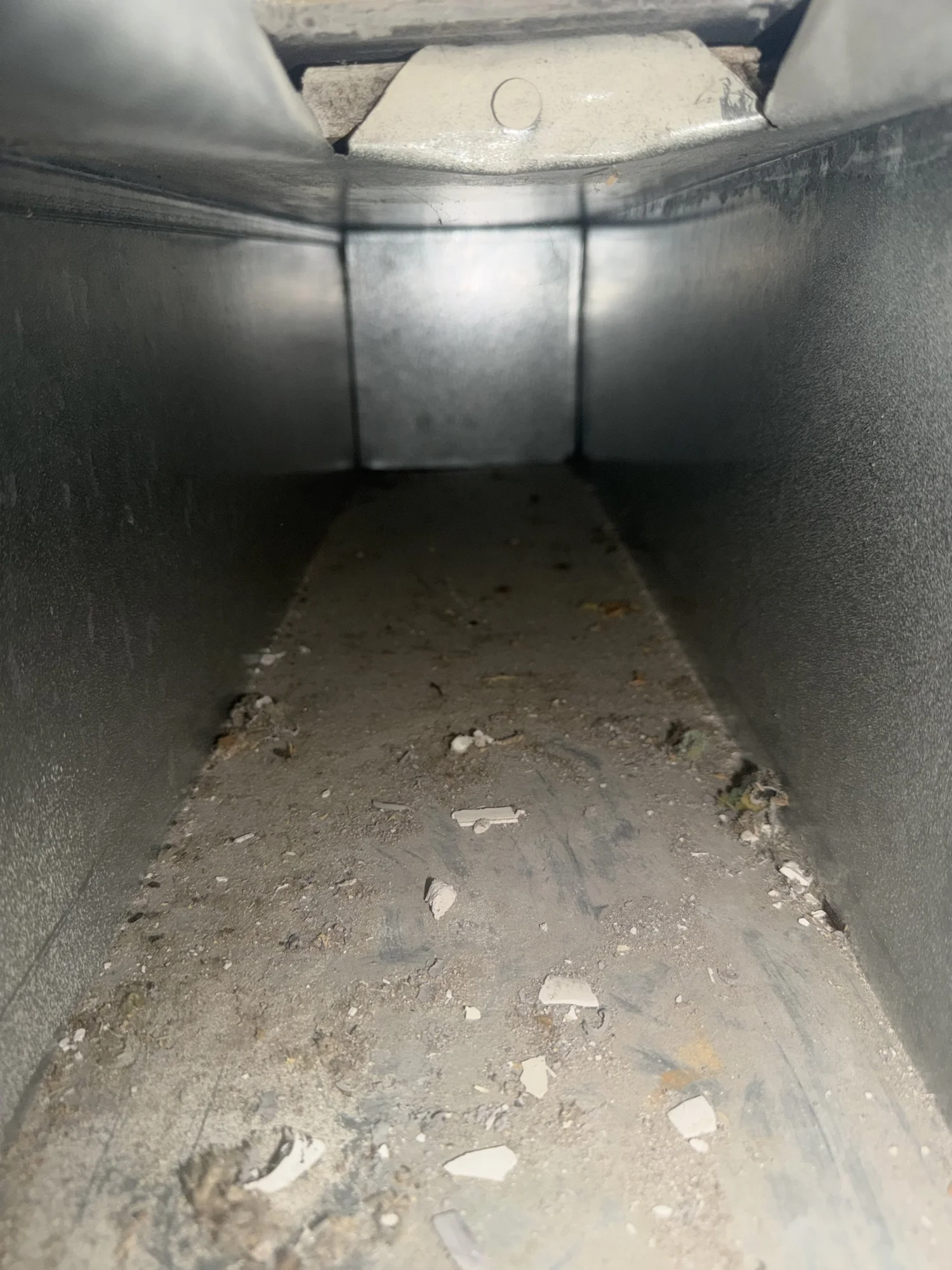 Dust and debris inside air duct before cleaning in Catonsville Maryland