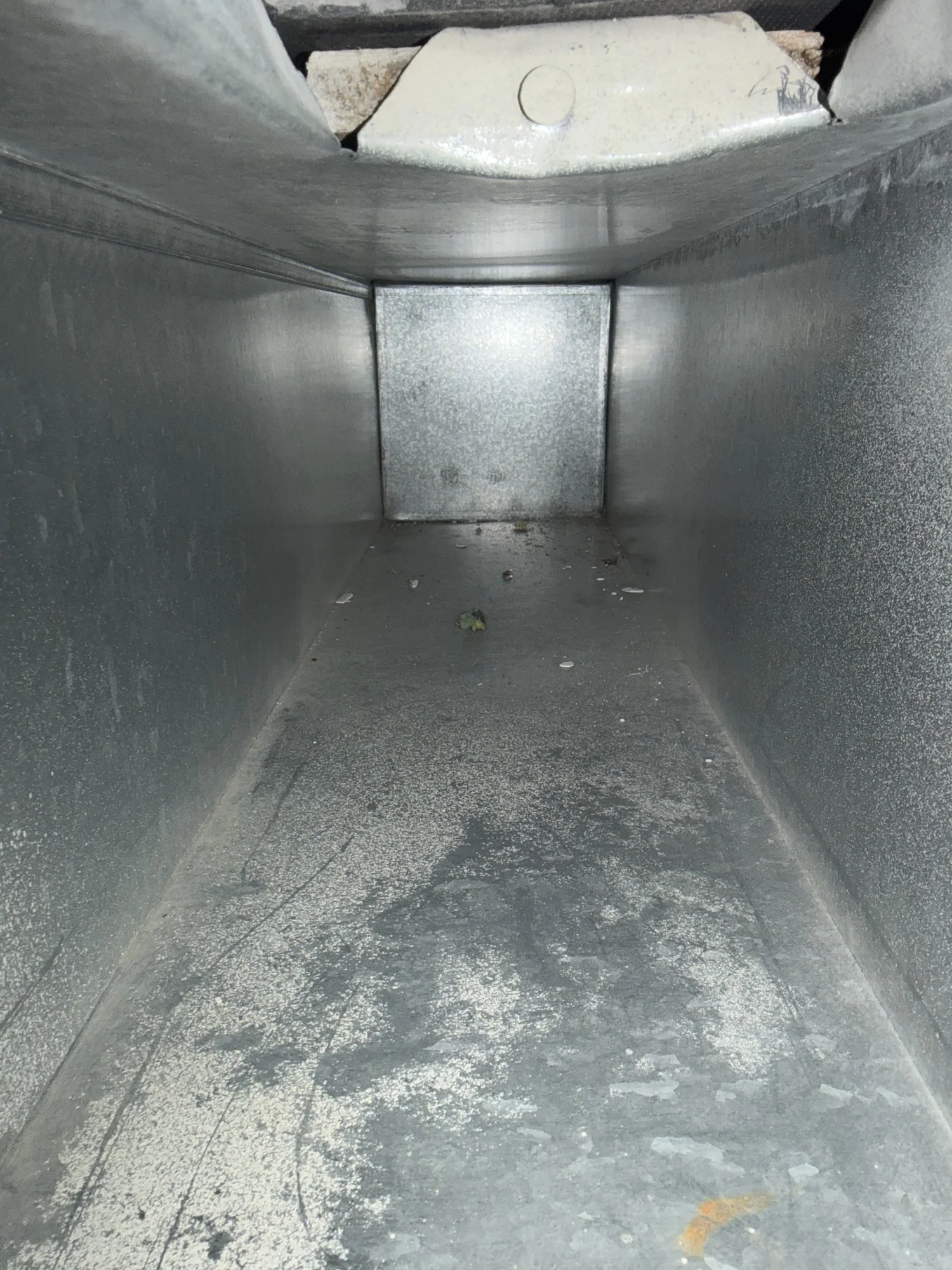 Metal air duct after professional air duct cleaning in Catonsville Maryland