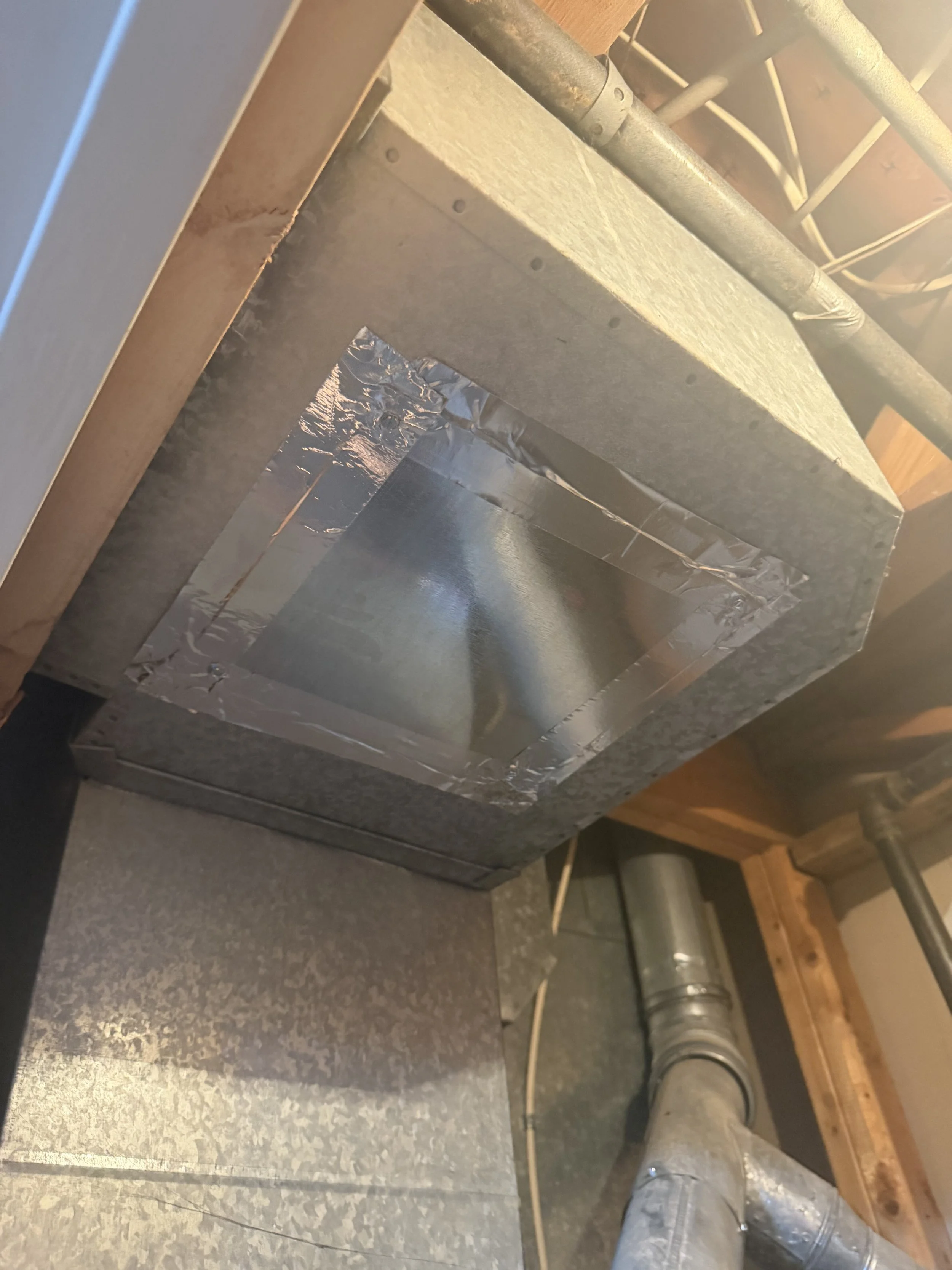Service opening properly closed and sealed after air duct cleaning.