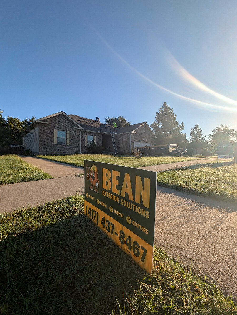 Bean Exterior Solutions yard sign in a yard