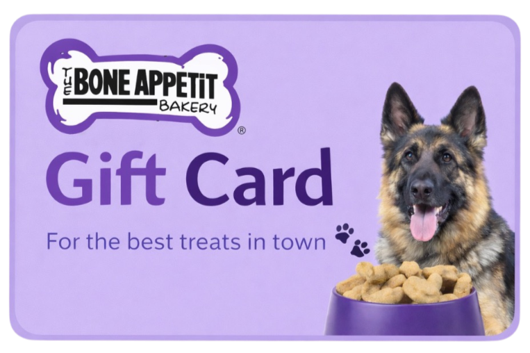 A purple gift card for The Bone Appetit Bakery featuring a German Shepherd with a bowl of dog treats.
