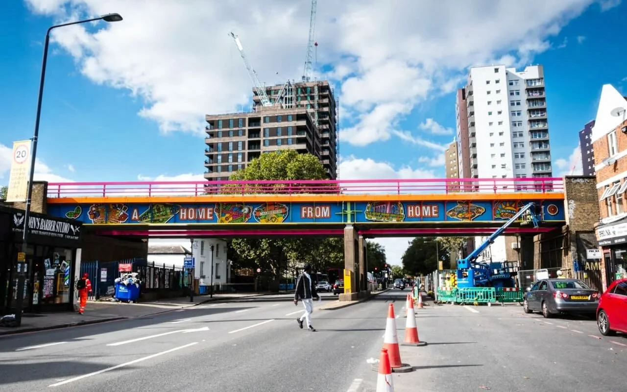 A Home from Home, Old Kent Road, London. 

So good to see it in its full glory. The other side of the bridge reads, Not Any Old Road. Both concepts and phrases were devised in collaboration with the communities by Peter and his creative team, with Yi