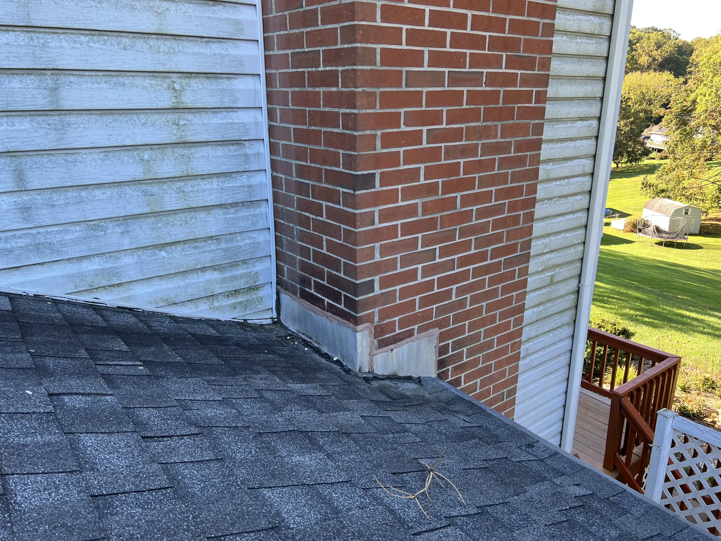 During certain rains, water would drip from the fireplace. Where the roof meets the chimney was the first place to look.