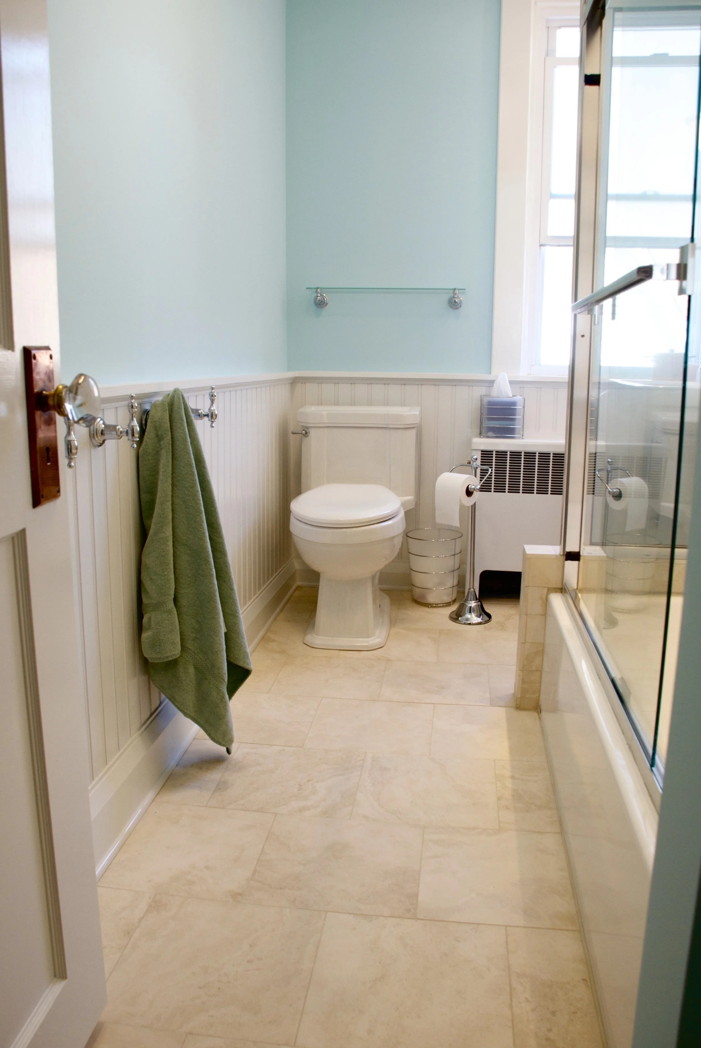A new door and moldings to match the rest of the house and custom milled wainscoting.