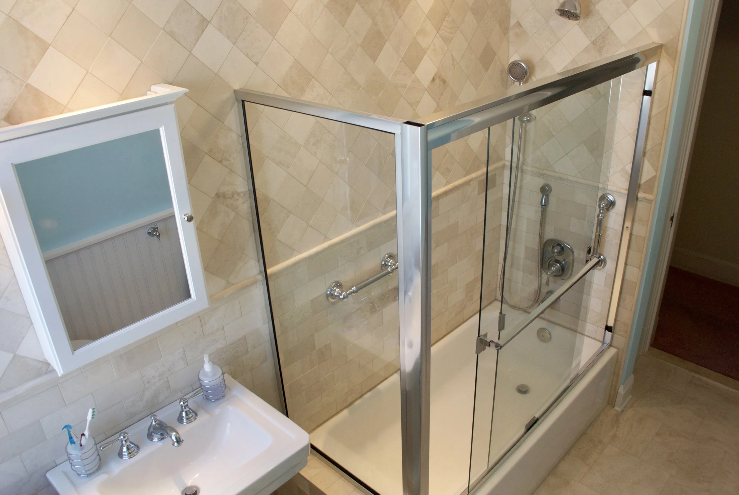 A remodel from the 1960s left this bathroom with uninteresting moldings and a door that didn’t match. 