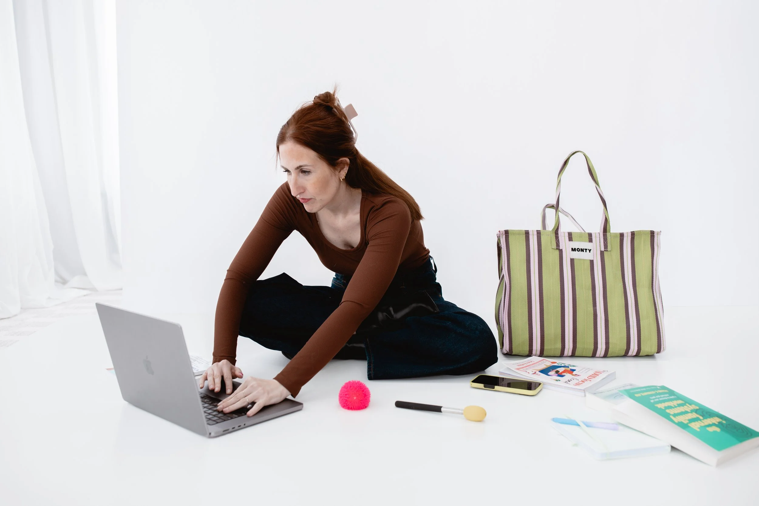 Samantha Skvaril, ADHD consultant in Illinois, working on a laptop.