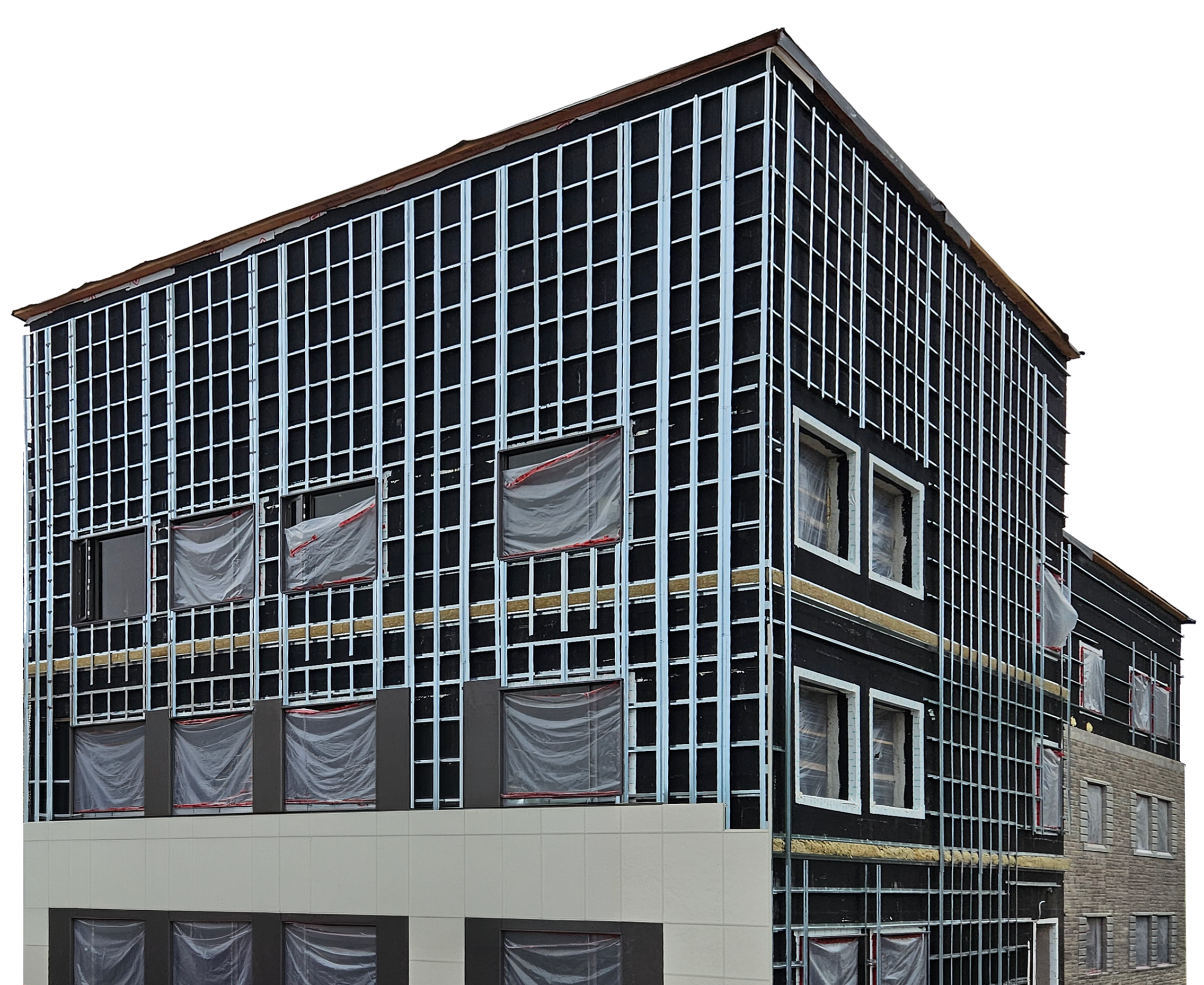 Building under construction with exposed framework and covered windows.