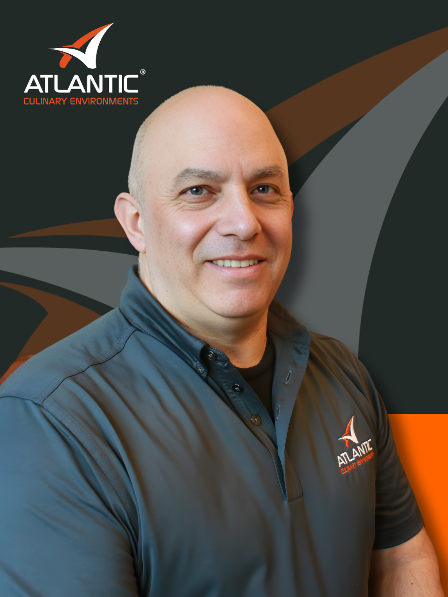 a man wearing Atlantic Culinary Environments polo