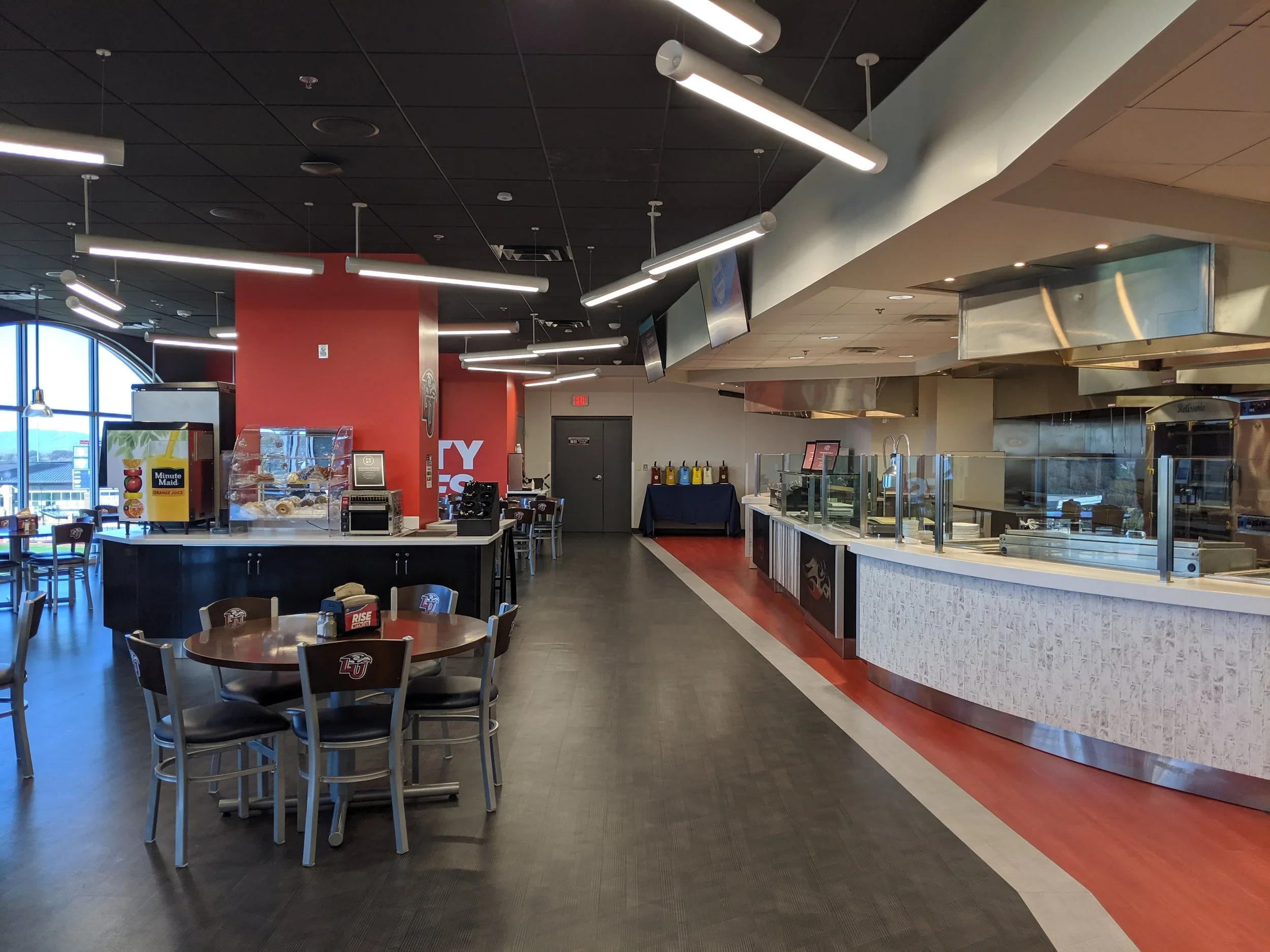 Custom stainless steel prep line in a commercial kitchen designed by Atlantic Culinary Environments.