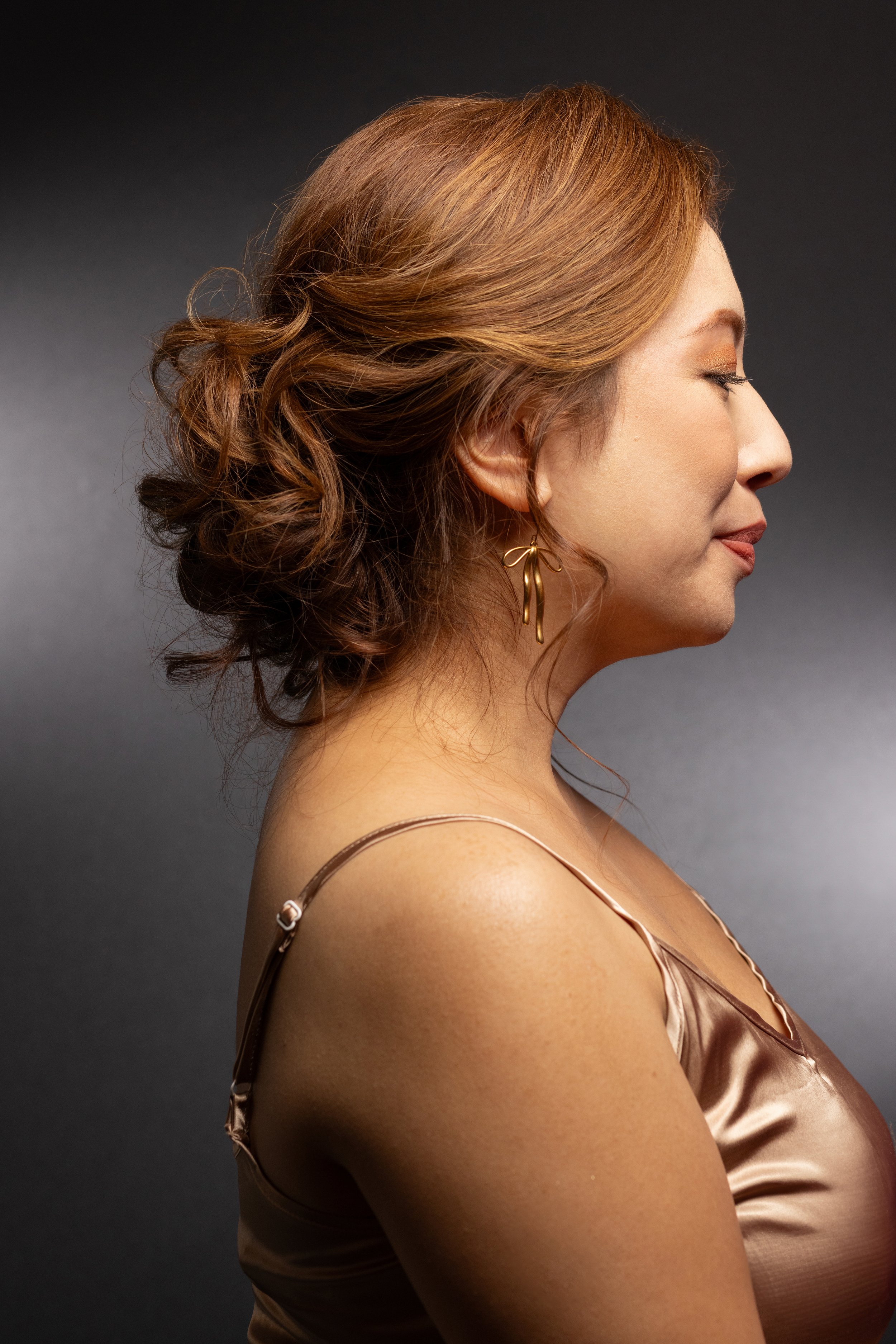 Light brown copper highlight styled in a sophisticated updo by Jill Janice, Union Beauty salon, Park Slope, Brooklyn.