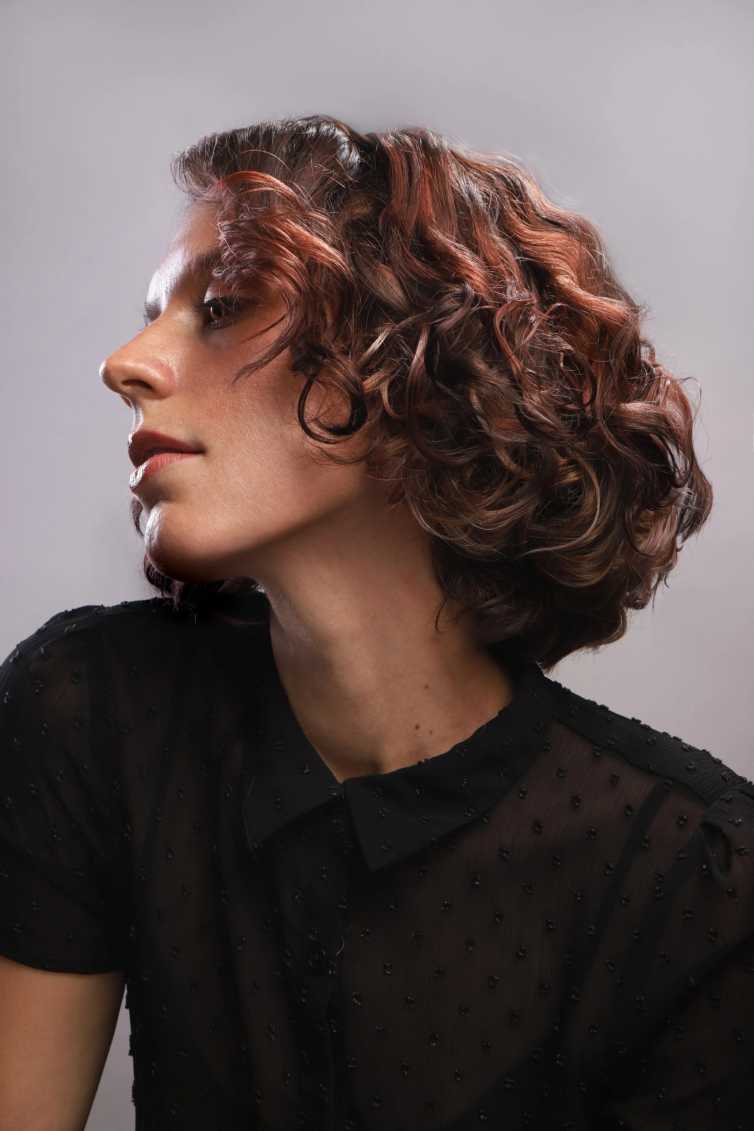Cherry cola highlights and curly bob by Russel Thompson, Union Beauty salon, Park Slope, Brooklyn.