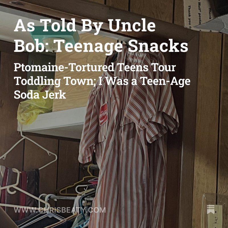 Clothing hanging on a hook, a yellow plastic bag, and part of a zigzag wall outlet.