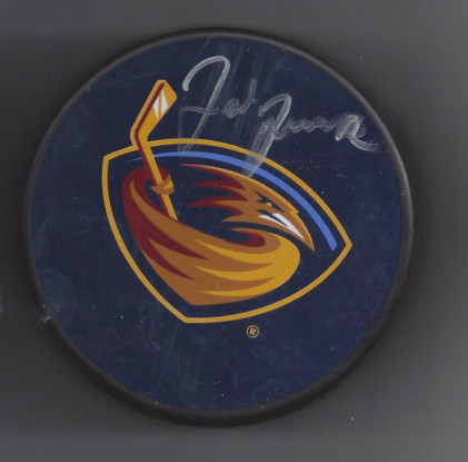 Hockey puck with the Atlanta Thrashers logo and handwritten signature.