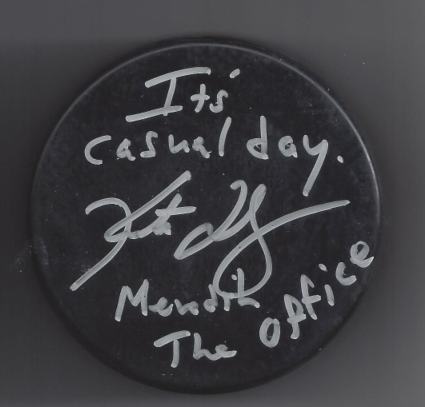 A round, clear badge with handwritten message: "It's casual day. Jean J. Menthol The Office."