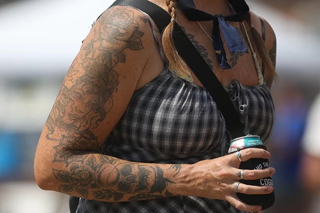 The Festival might well be the state's first mobile art gallery. Creative tattoos are everywhere - some run the full length of people arms and legs. Couples sport matching body art. 