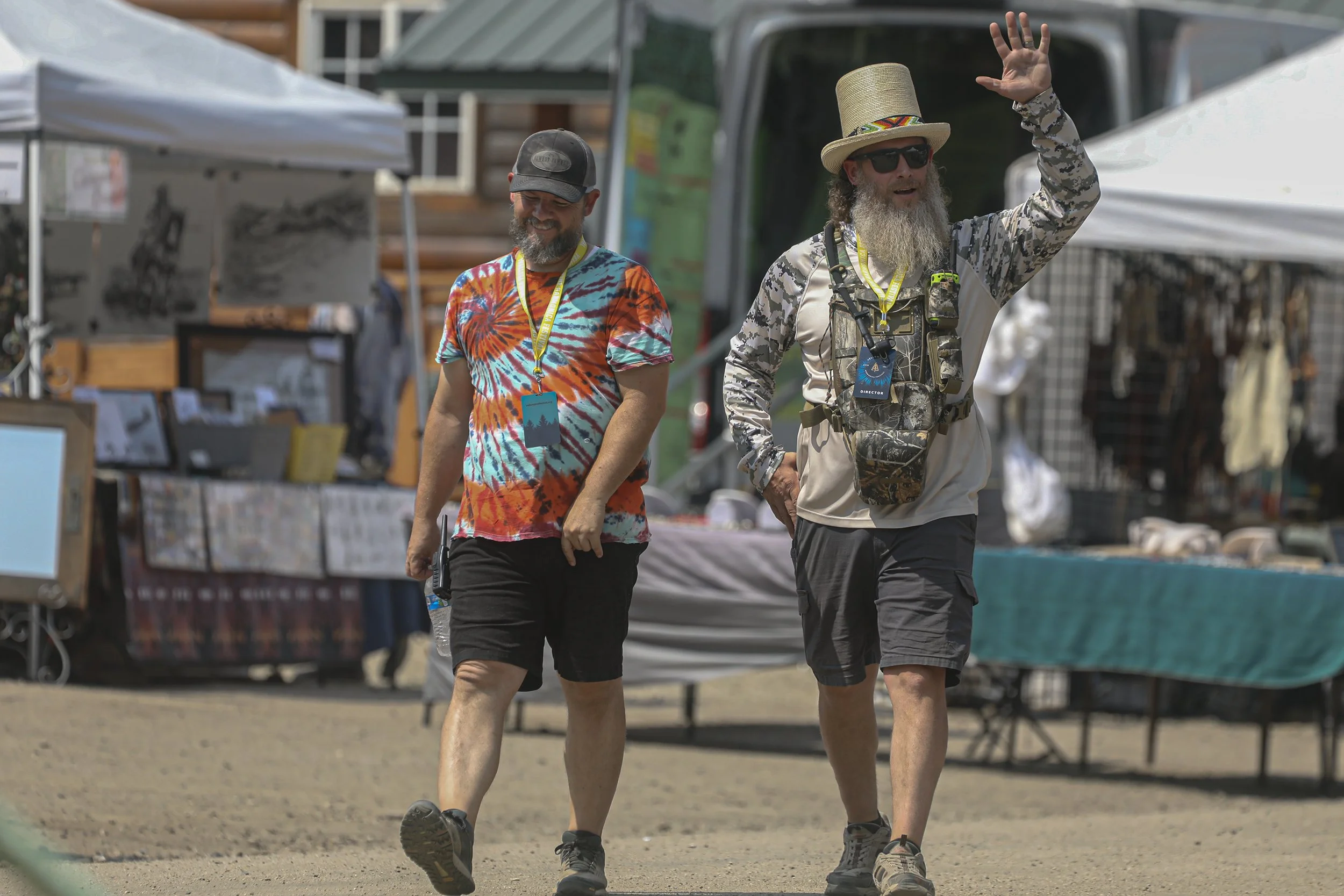 TeJay Rogers and Jason Stephens walking along Main Street. Rodgers and Stephens live in Boise and donate their time to helping  the festival. Rodgers is the Production Coordinator managing the musical talent. Stephens is the Festival Director, but al