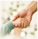 Adult and child holding hands