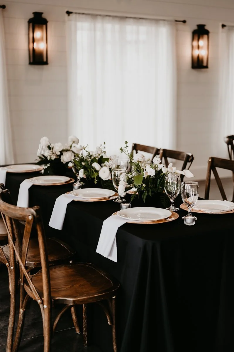 Medium Floral Arrangements on Black and White Tablescape Designed by Unique by Design at Crimson Lane Wedding Venue in Ada, Ohio photos by Julia Brown Photo
